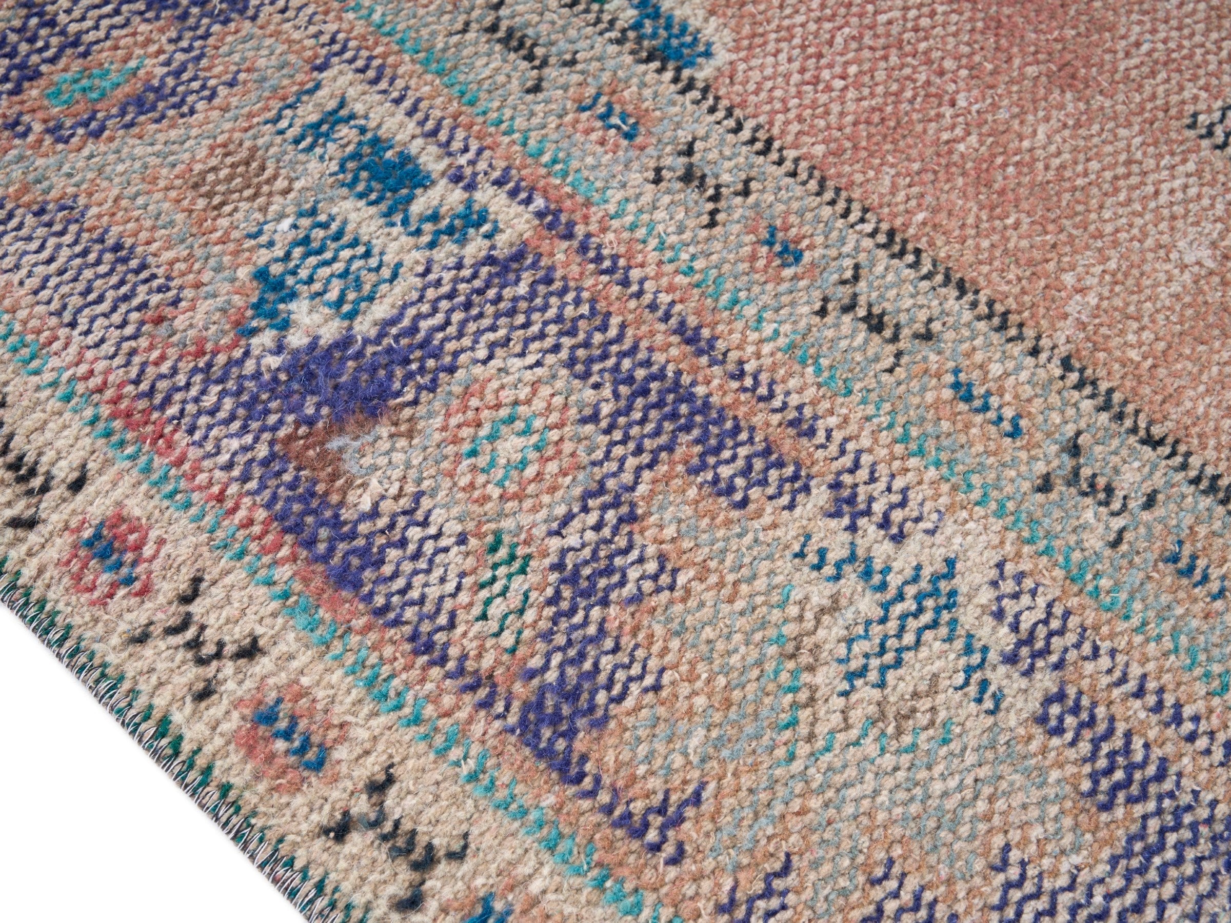 Turkish Manisa area rug in terracotta and navy, view 6 of 10