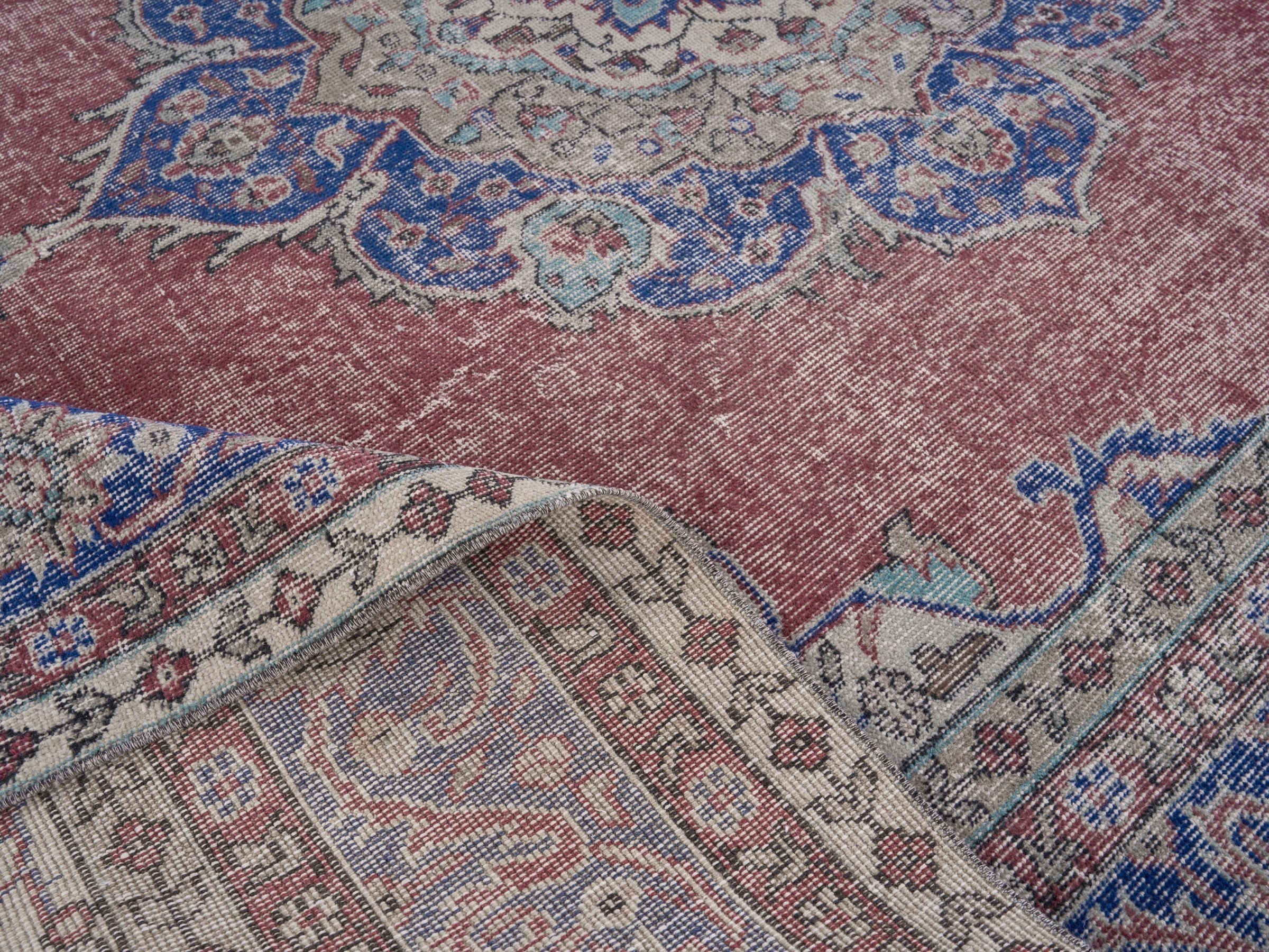 Turkish Isparta area rug in faded red and dark blue, view 6 of 7