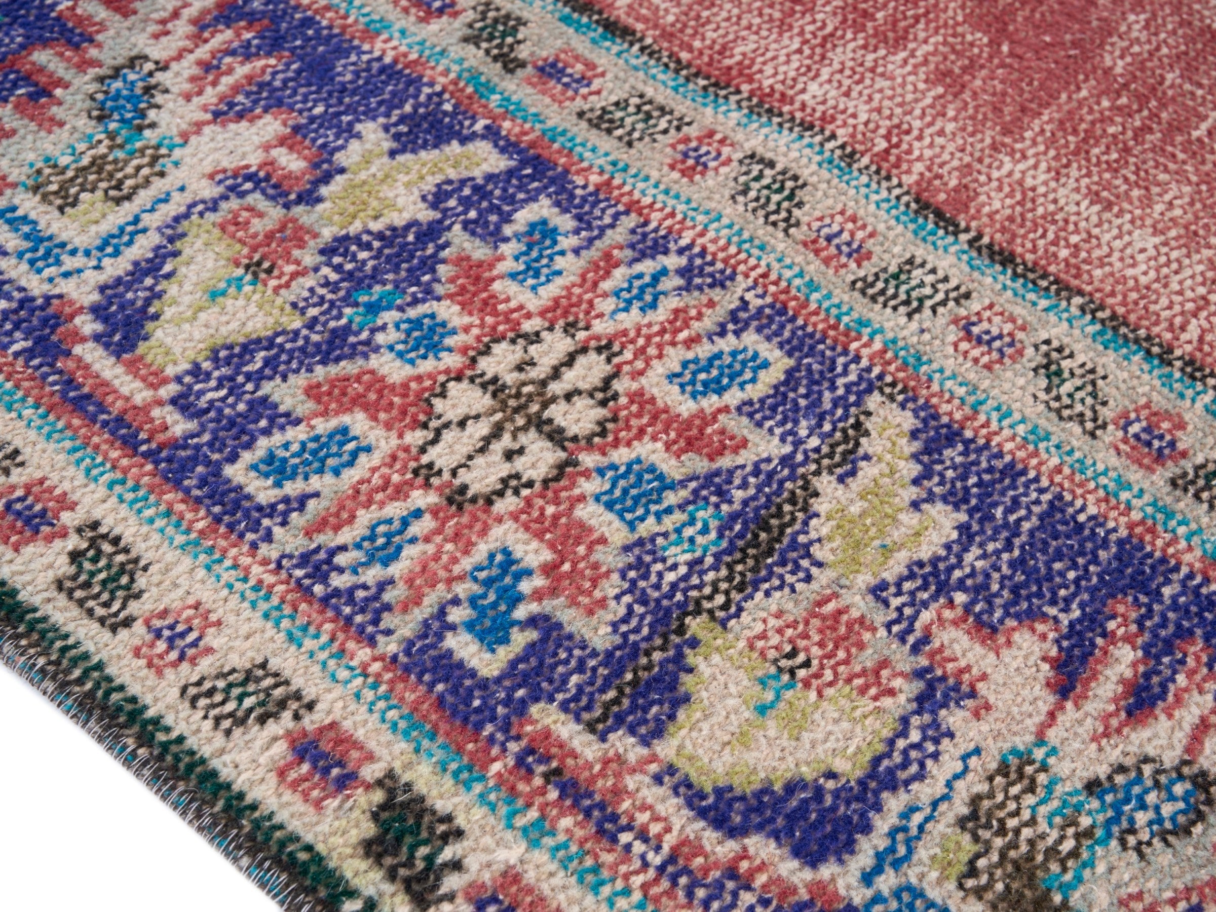 Turkish Manisa area rug in rose and navy, view 6 of 10