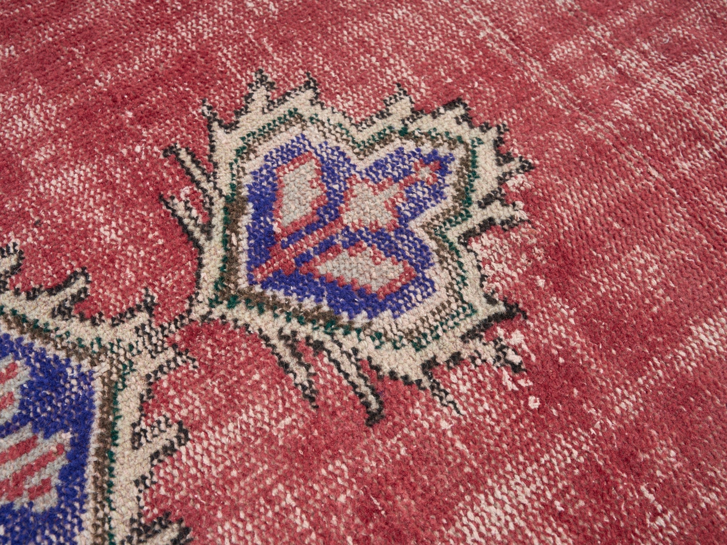 Turkish Manisa area rug in rose and navy, view 7 of 10