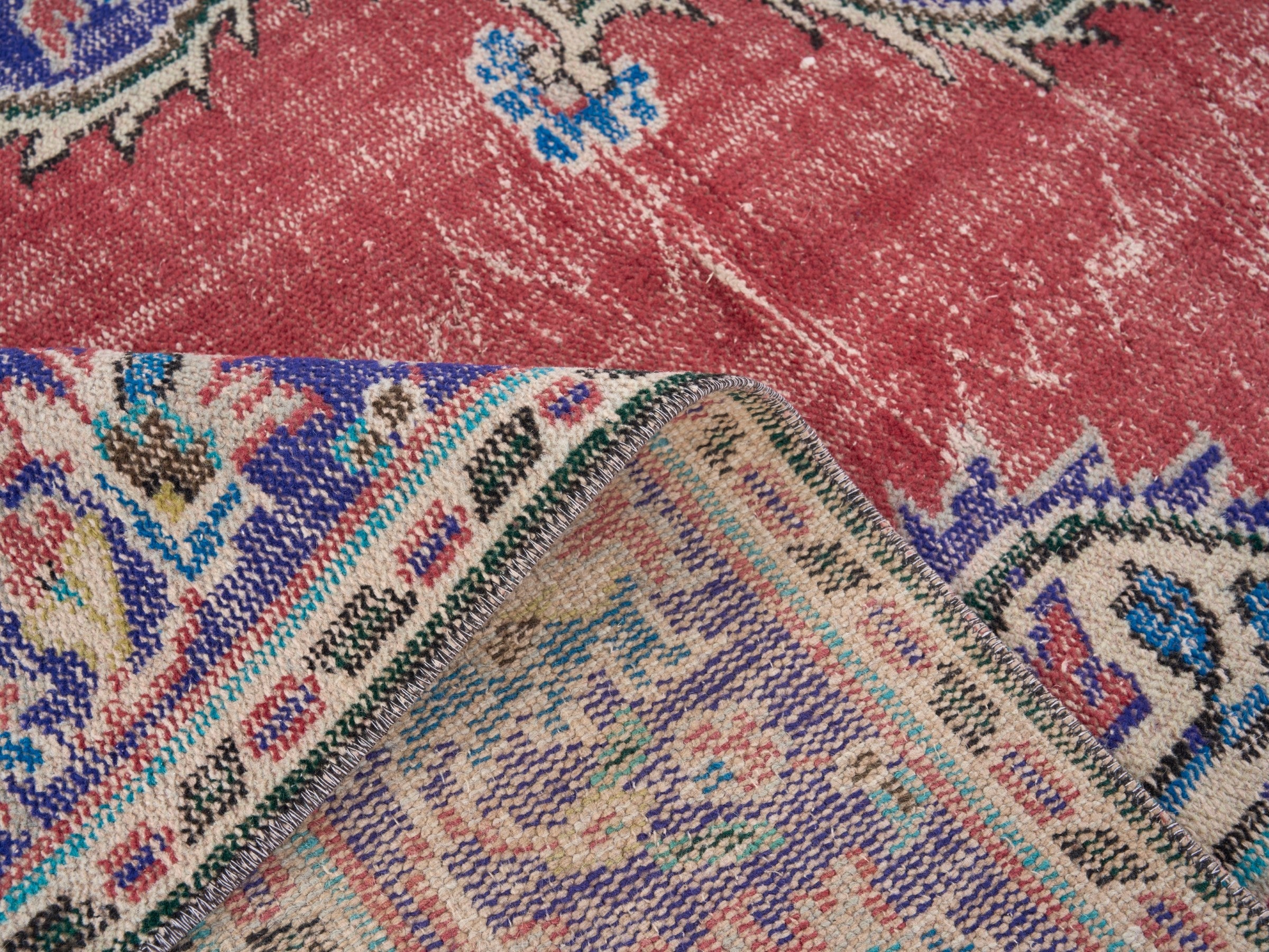 Turkish Manisa area rug in rose and navy, view 9 of 10