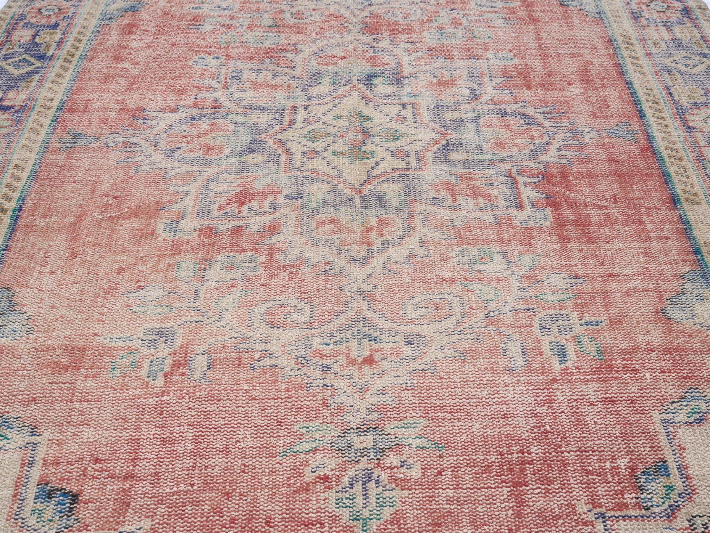 Turkish Manisa area rug in muted pink and navy, view 4 of 10