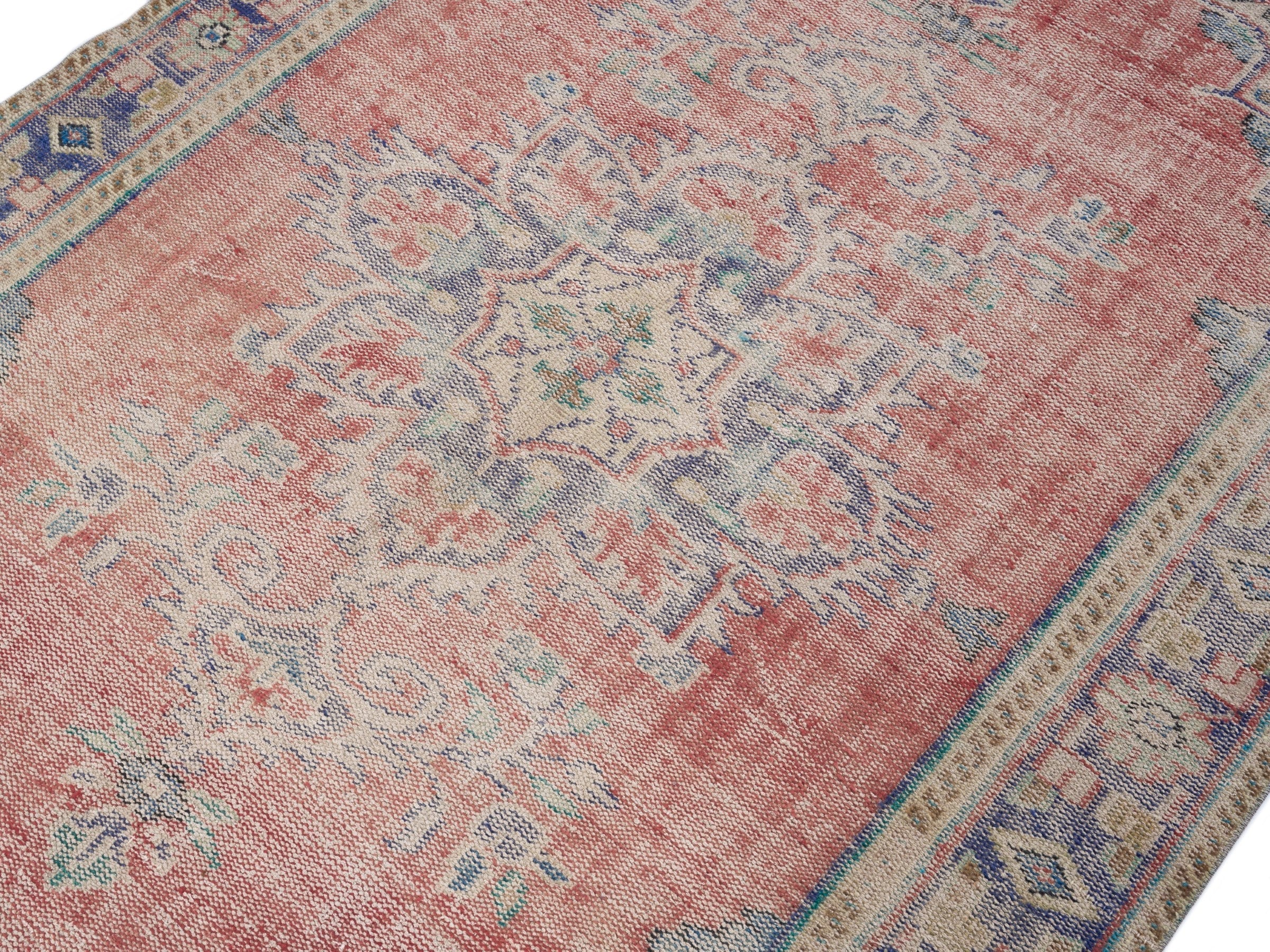 Turkish Manisa area rug in muted pink and navy, view 5 of 10