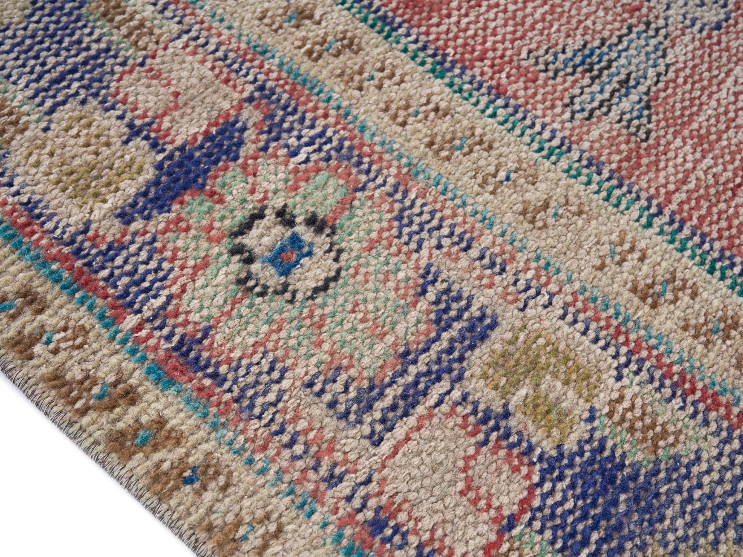 Turkish Manisa area rug in muted pink and navy, view 6 of 10