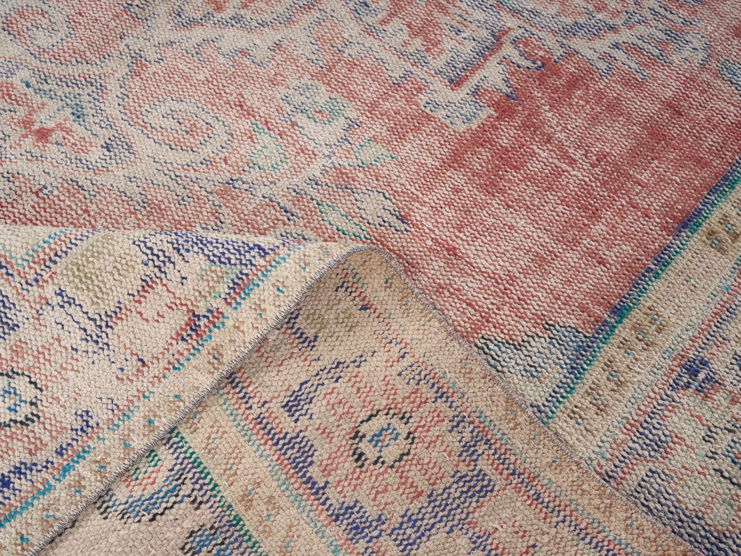 Turkish Manisa area rug in muted pink and navy, view 9 of 10