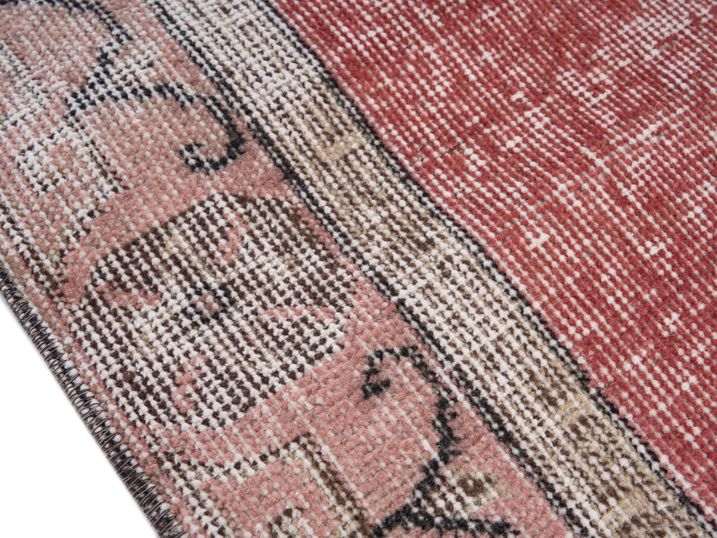 Turkish Isparta area rug in faded red and greige, view 6 of 10
