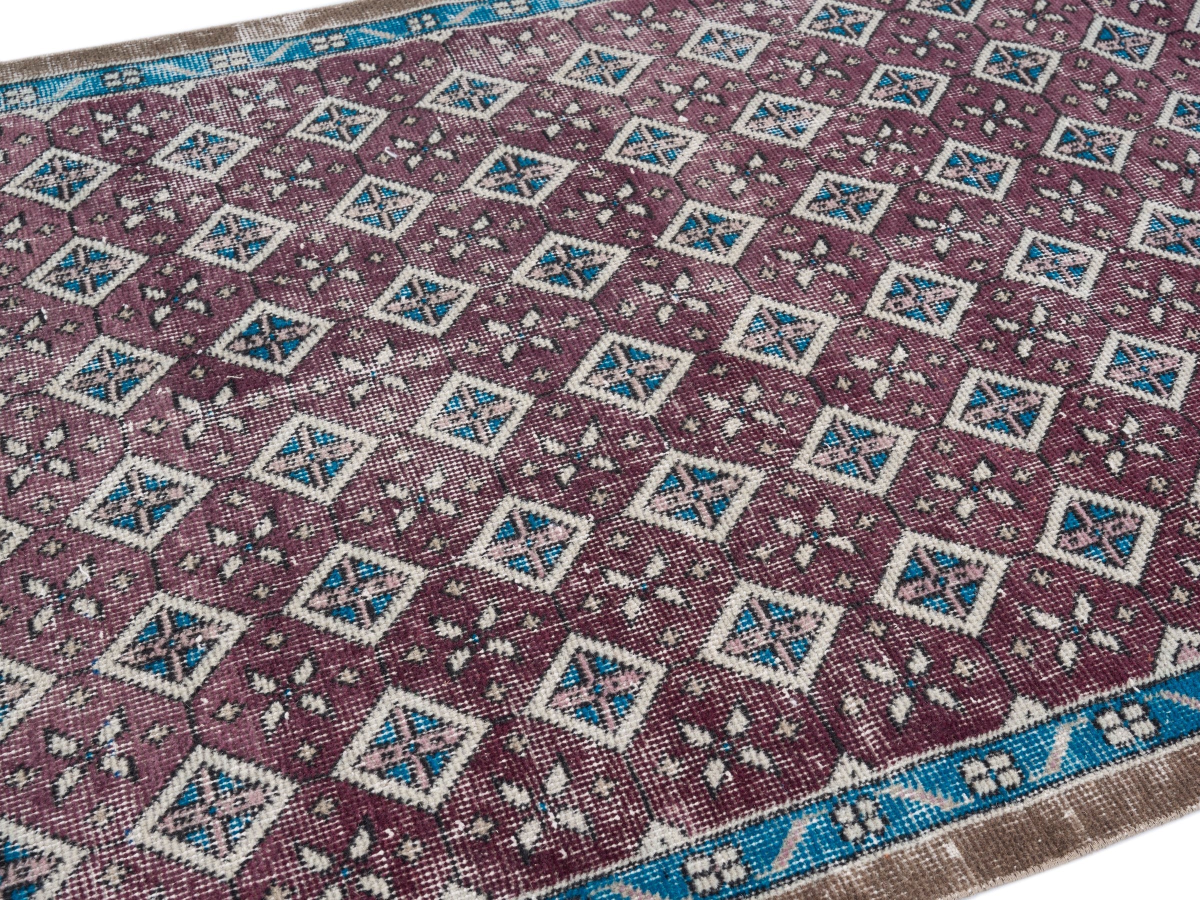 Turkish Isparta accent rug in burgundy and turquoise, view 5 of 10