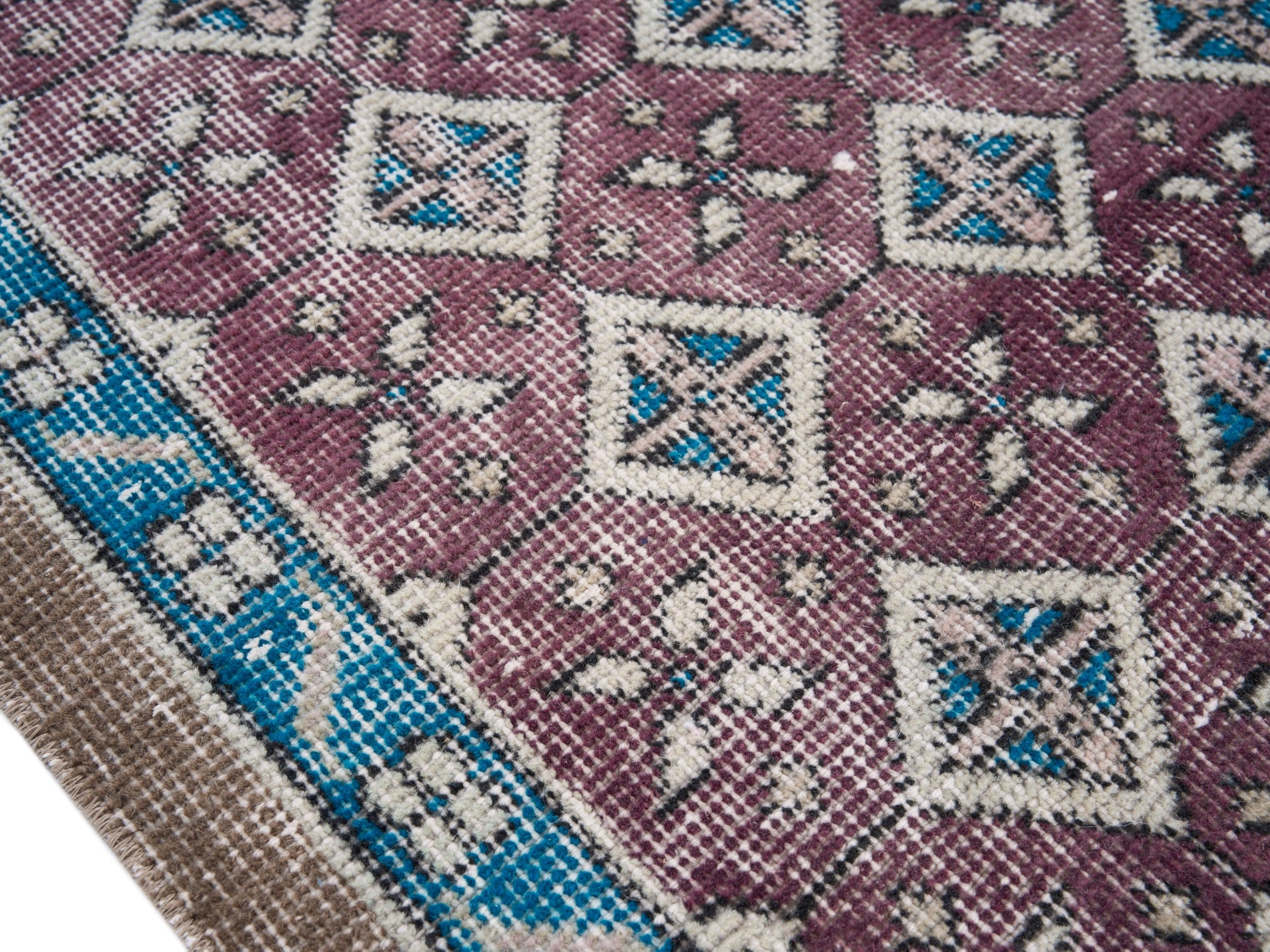 Turkish Isparta accent rug in burgundy and turquoise, view 6 of 10