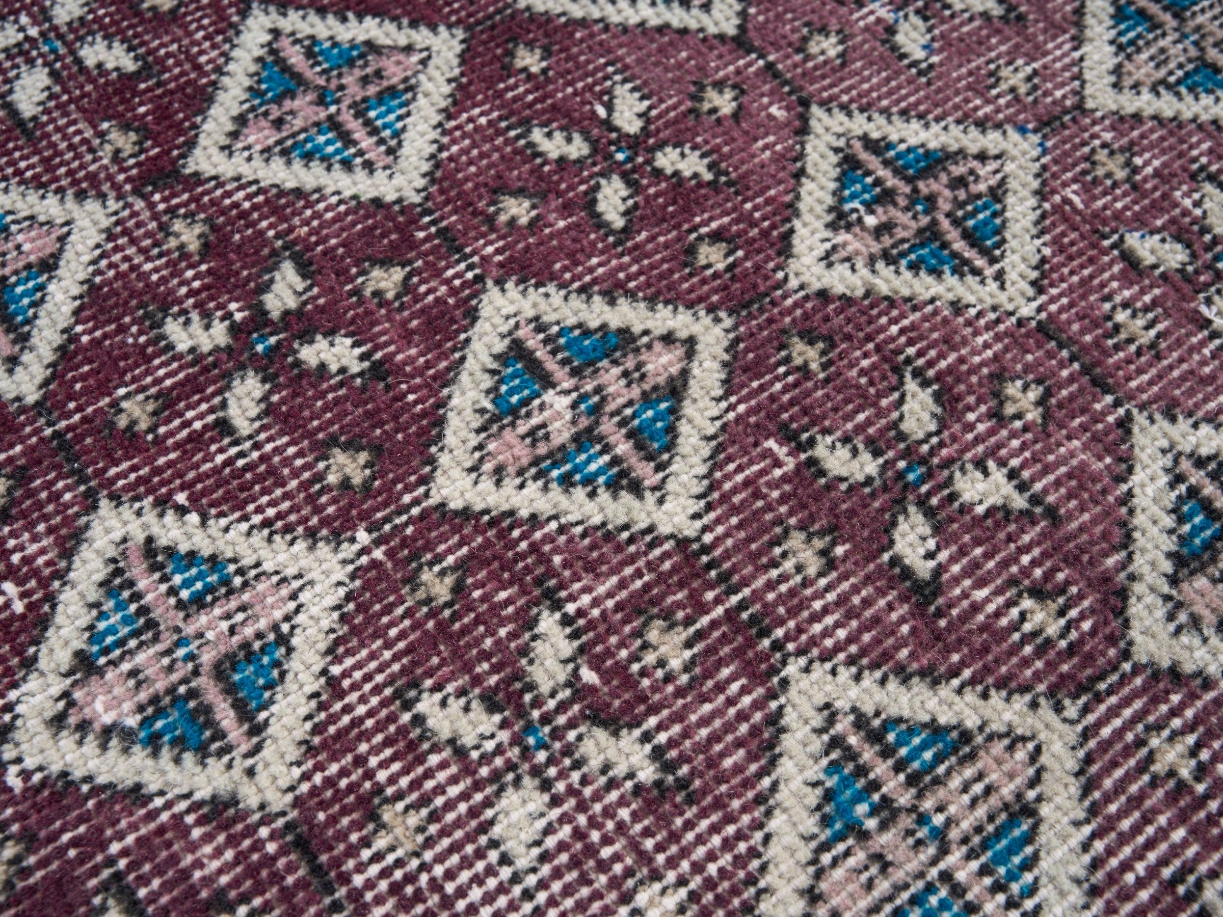 Turkish Isparta accent rug in burgundy and turquoise, view 7 of 10