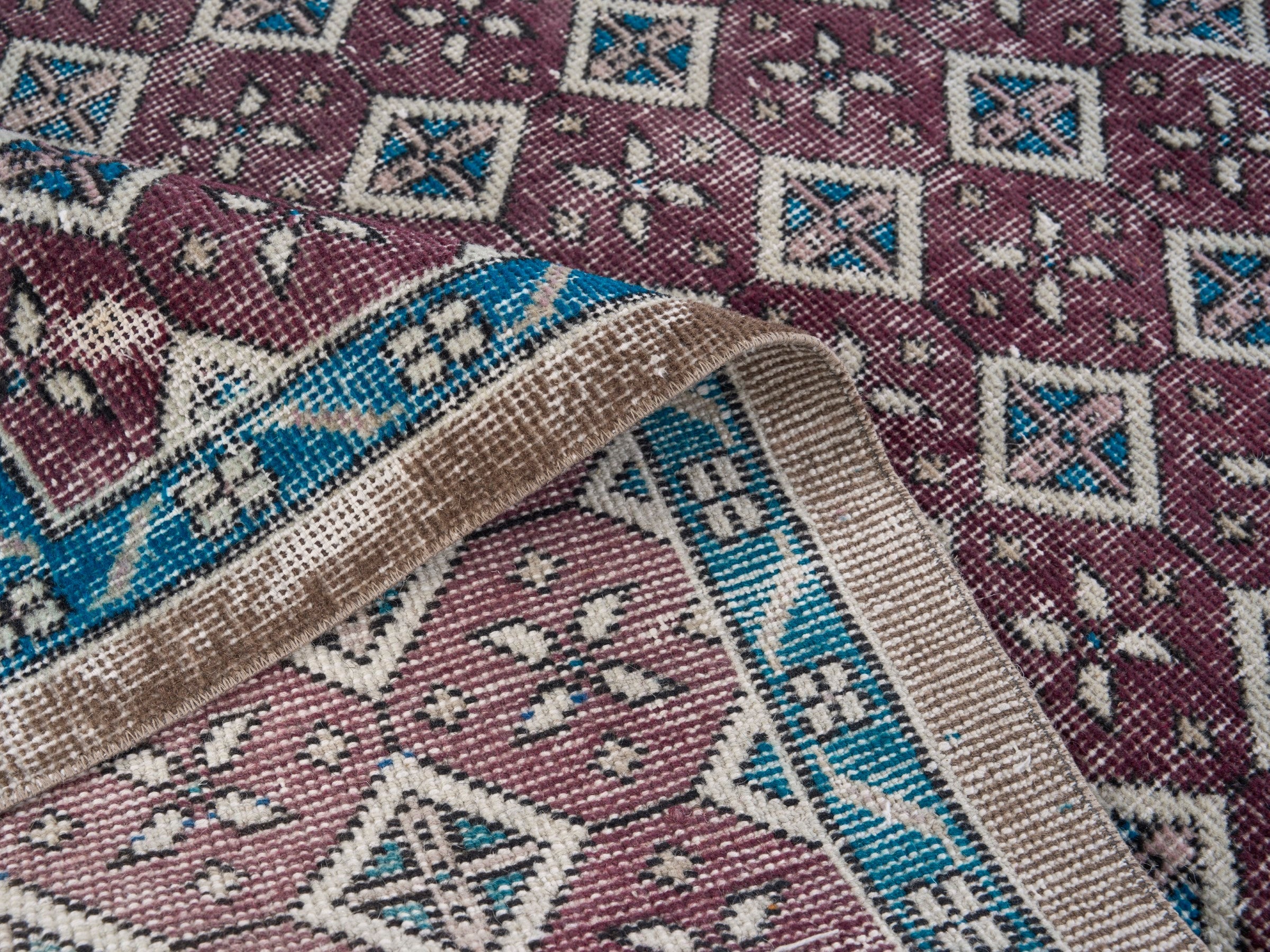 Turkish Isparta accent rug in burgundy and turquoise, view 9 of 10