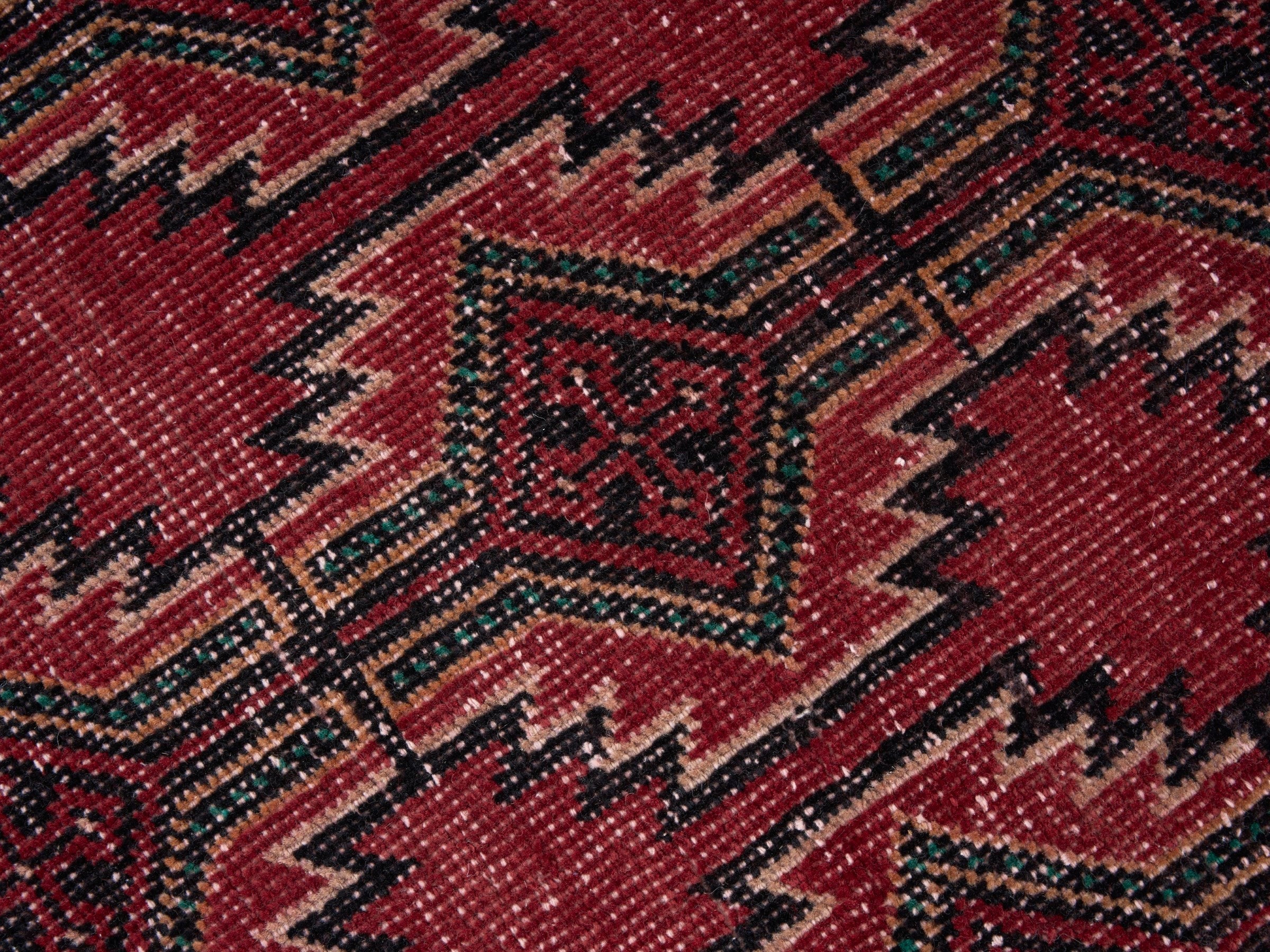 Persian Baluch area rug in deep red and burgundy, view 7 of 10