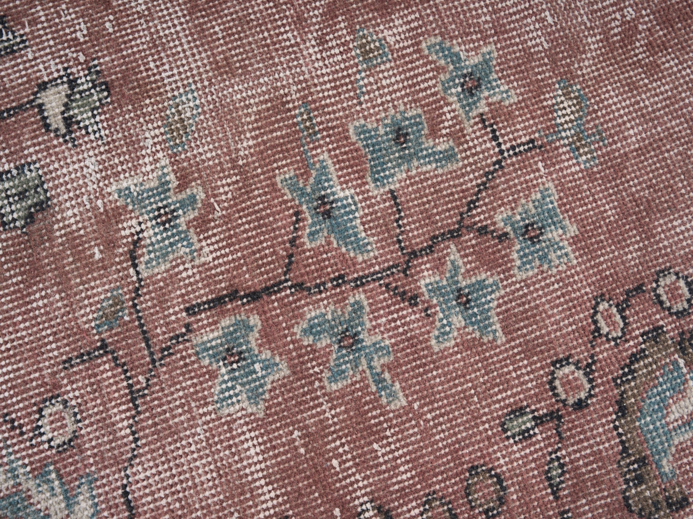 Turkish Isparta area rug in faded red and cream, view 7 of 10