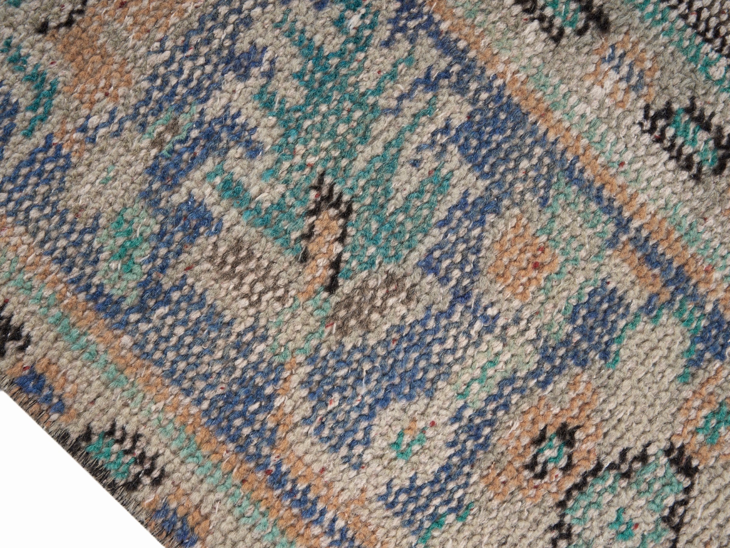 Turkish Manisa area rug in tan and denim, view 6 of 10