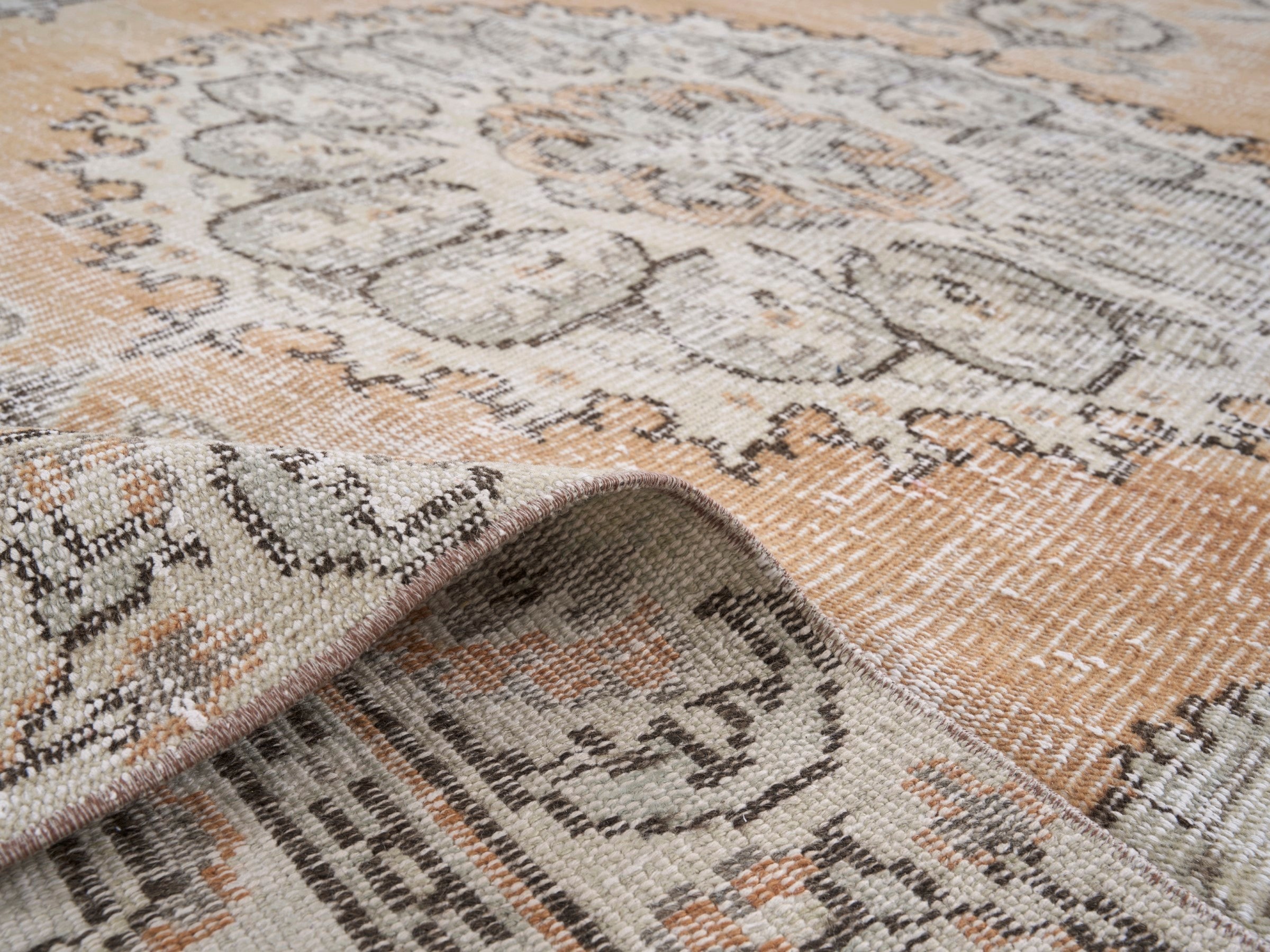 Turkish Manisa area rug in apricot and cream, view 9 of 10