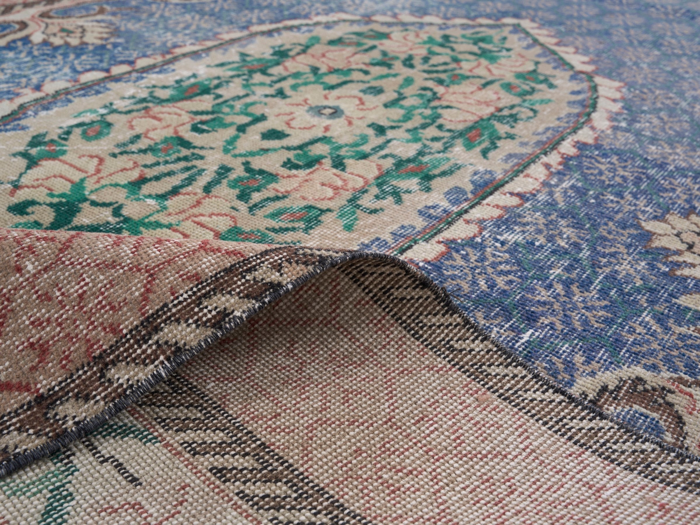Turkish Isparta area rug in dark blue and rose, view 9 of 10