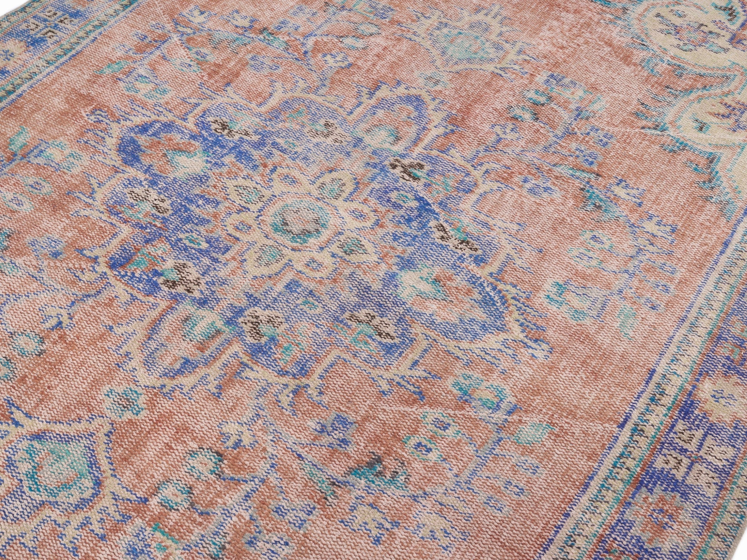 Turkish Manisa area rug in terracotta and navy, view 5 of 10