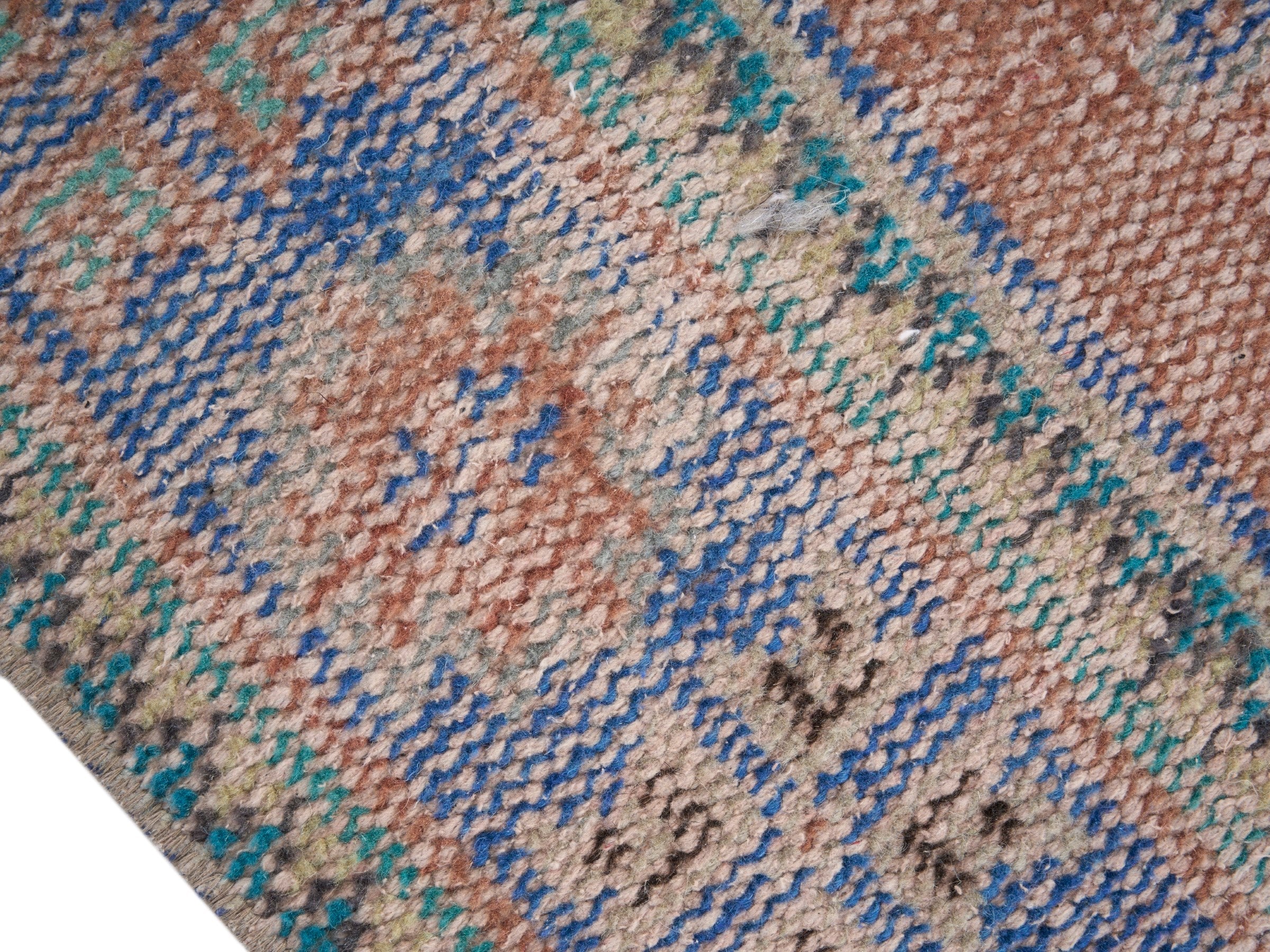 Turkish Manisa area rug in terracotta and navy, view 6 of 10