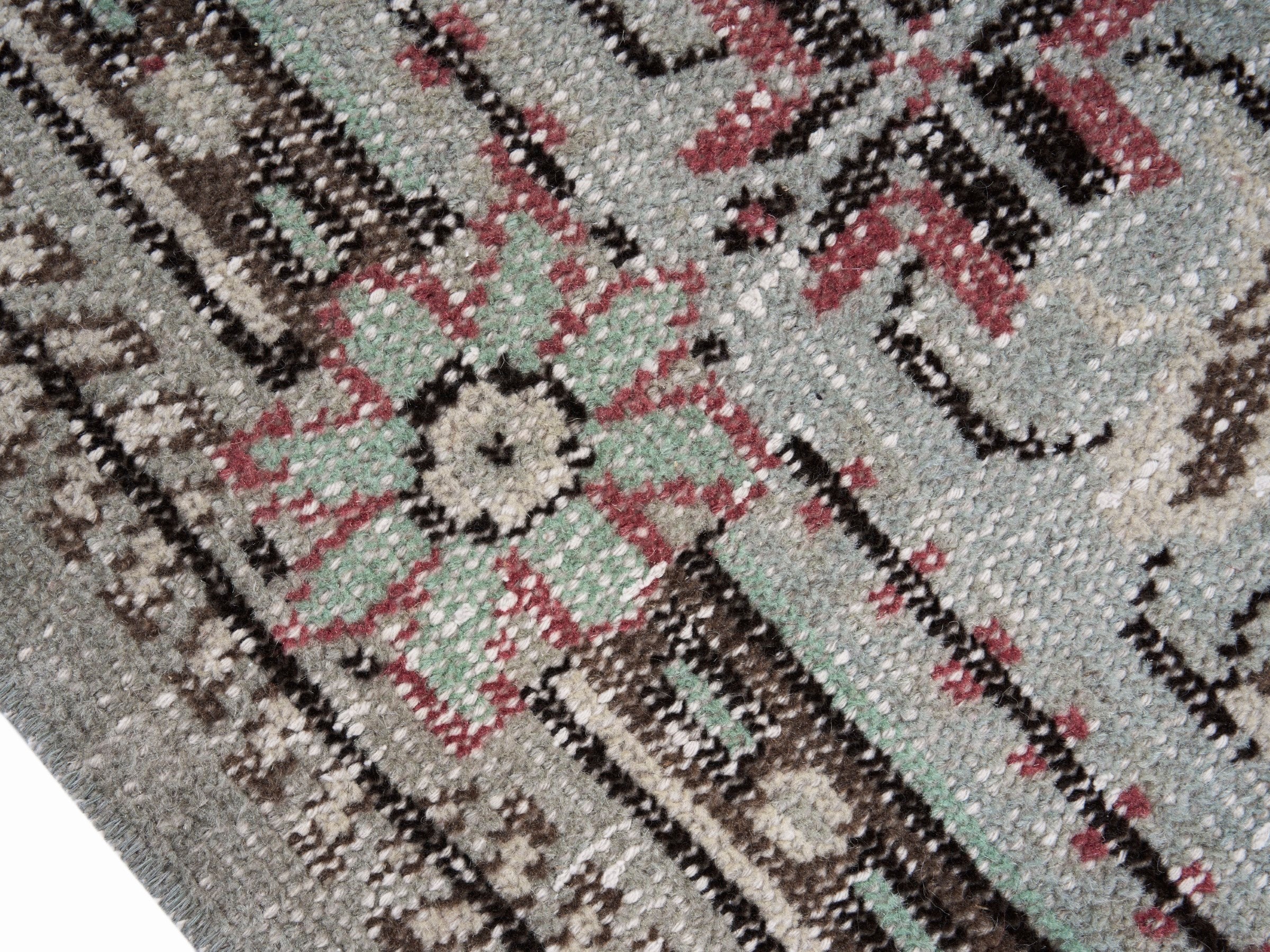Turkish Manisa oversized rug in faded red and cream, view 6 of 10