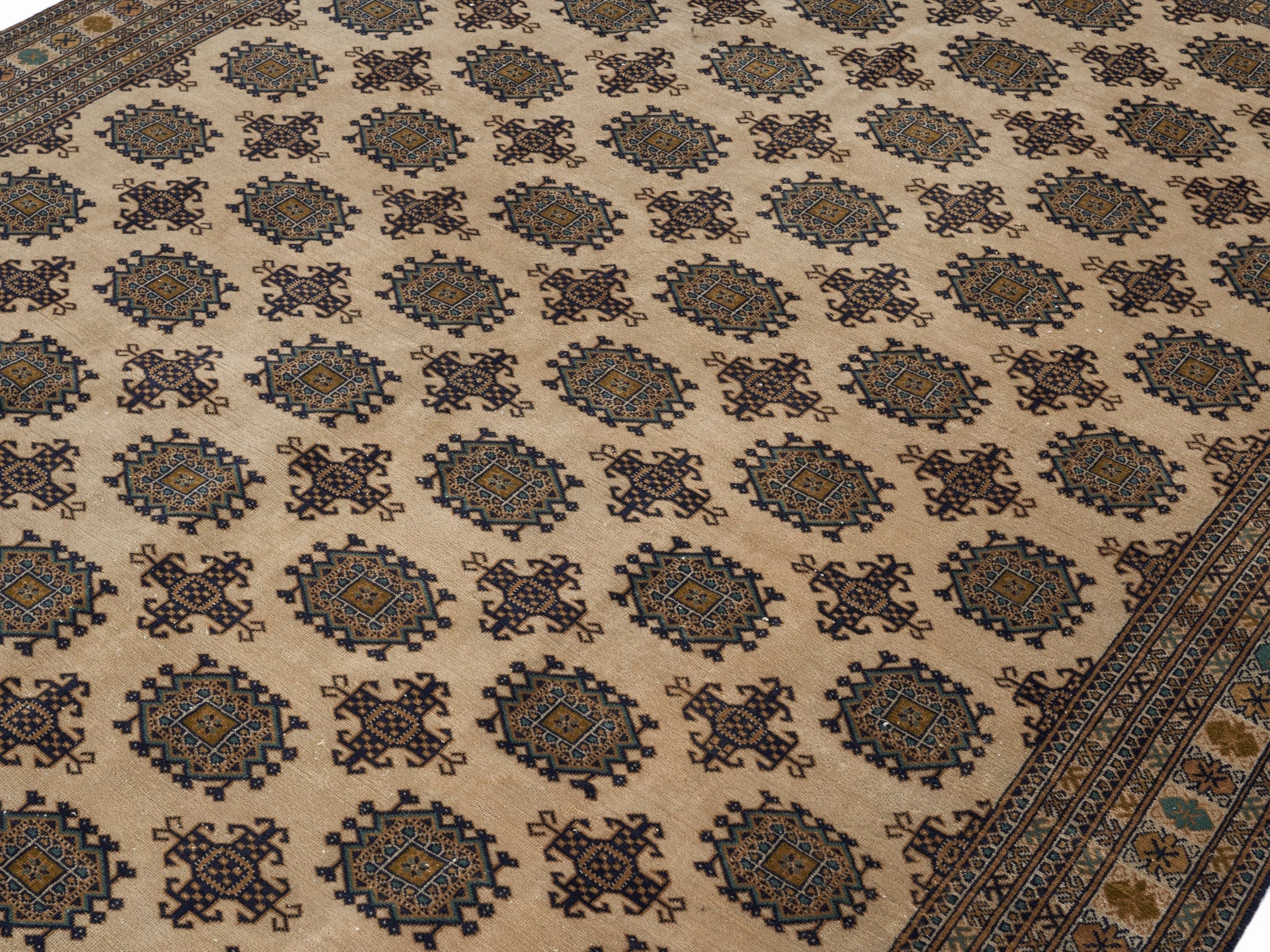 Persian Torkaman area rug in cream and navy, view 5 of 15