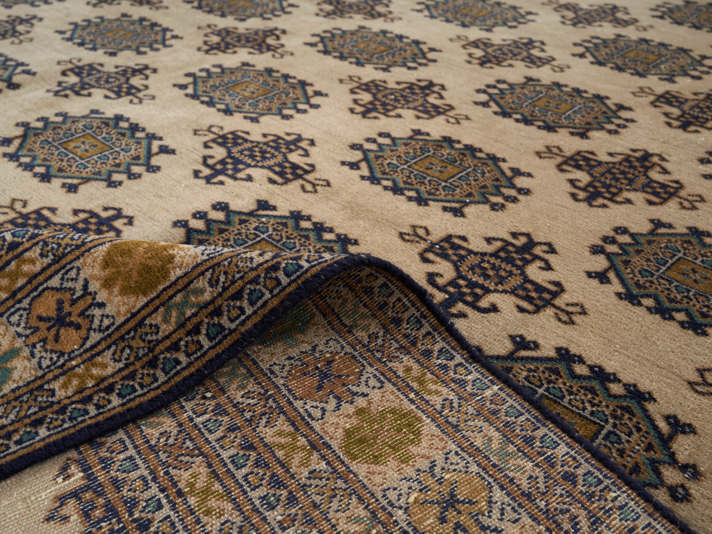 Persian Torkaman area rug in cream and navy, view 14 of 15