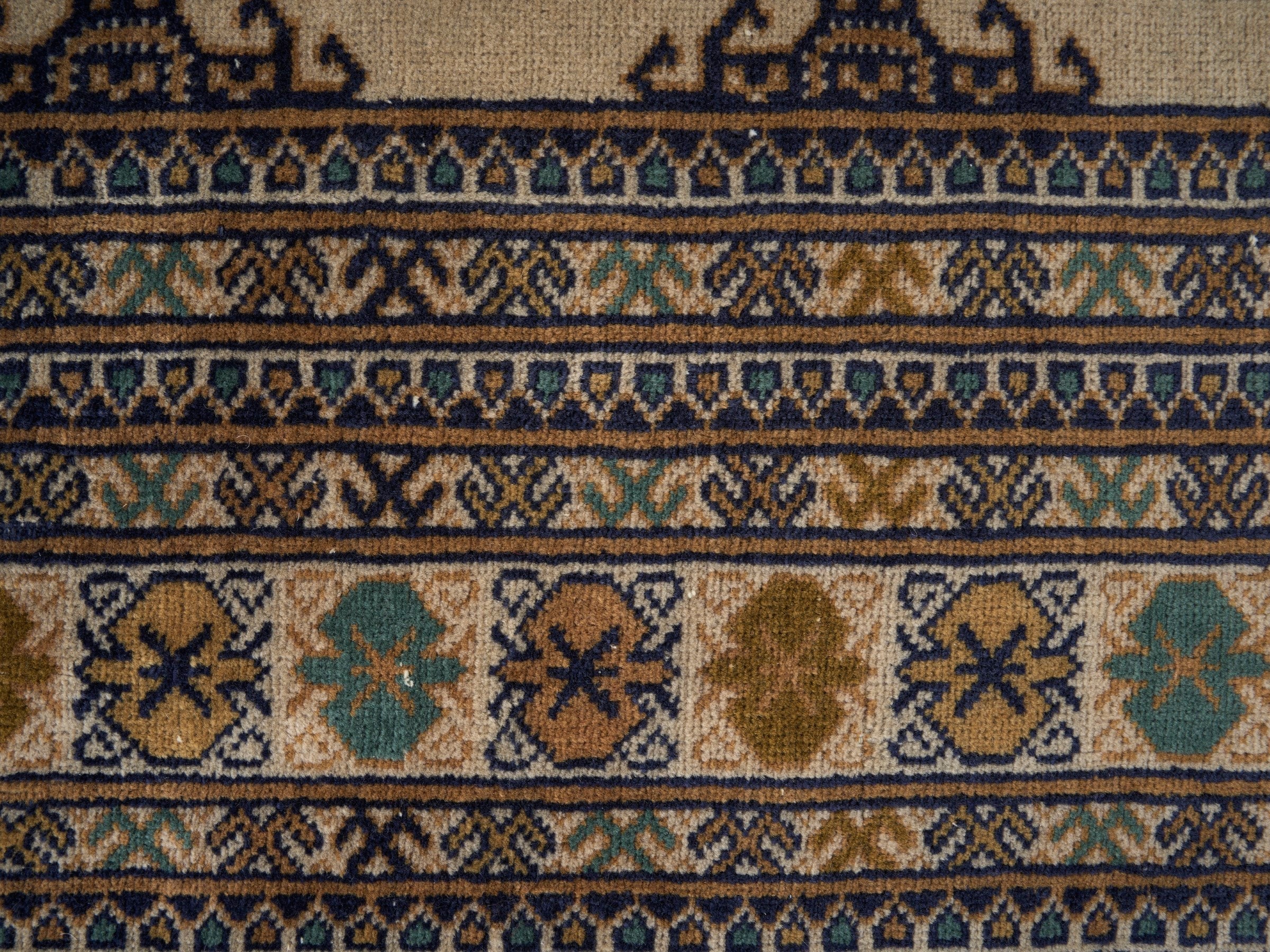 Persian Torkaman area rug in cream and navy, view 10 of 15