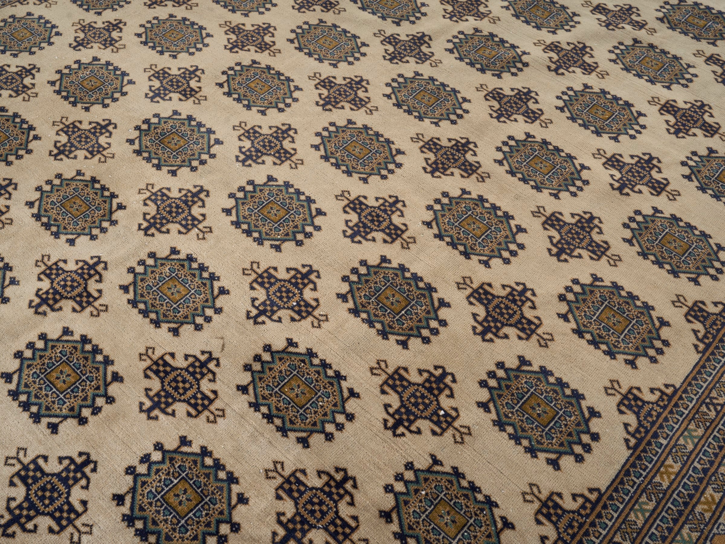 Persian Torkaman area rug in cream and navy, view 12 of 15