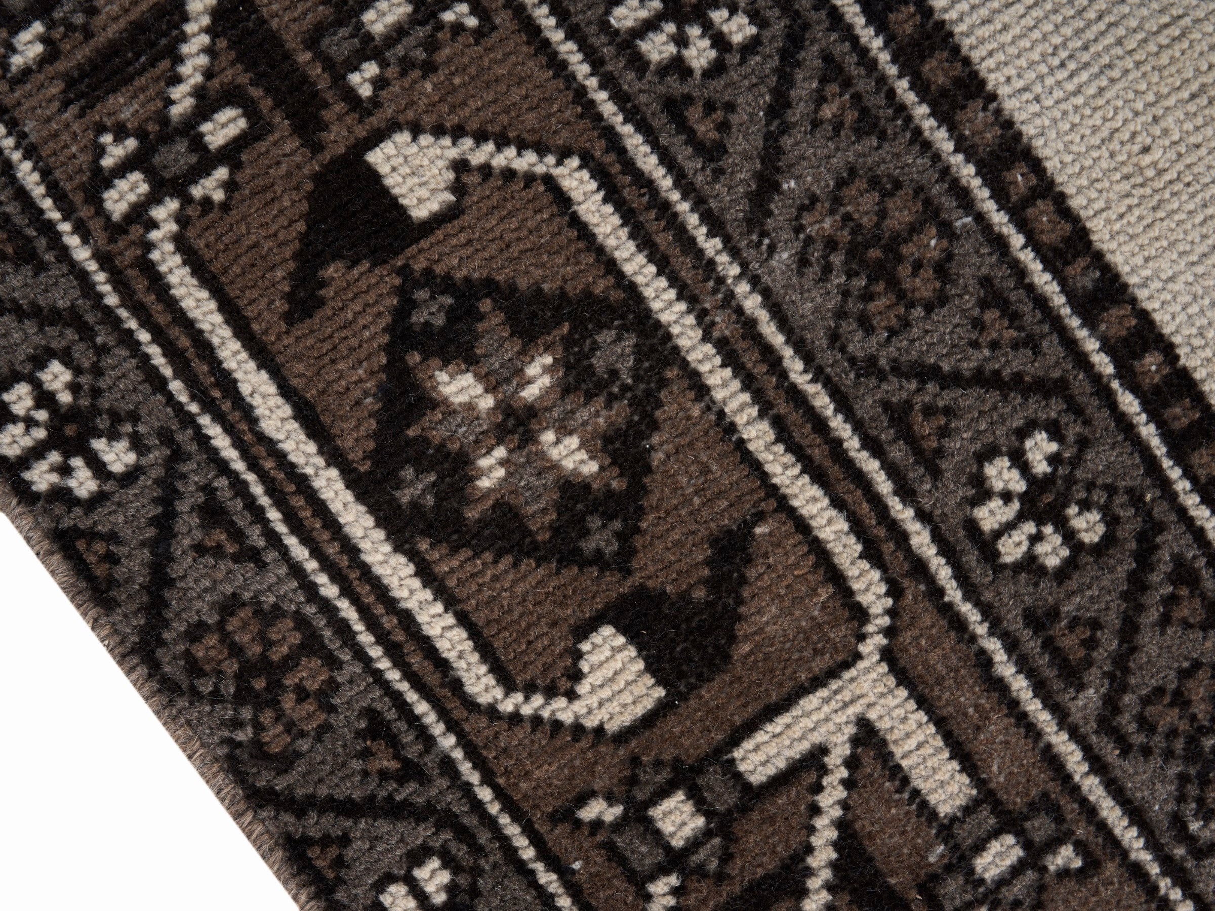 Persian Ferdos oversized rug in cream and dark brown, view 6 of 15