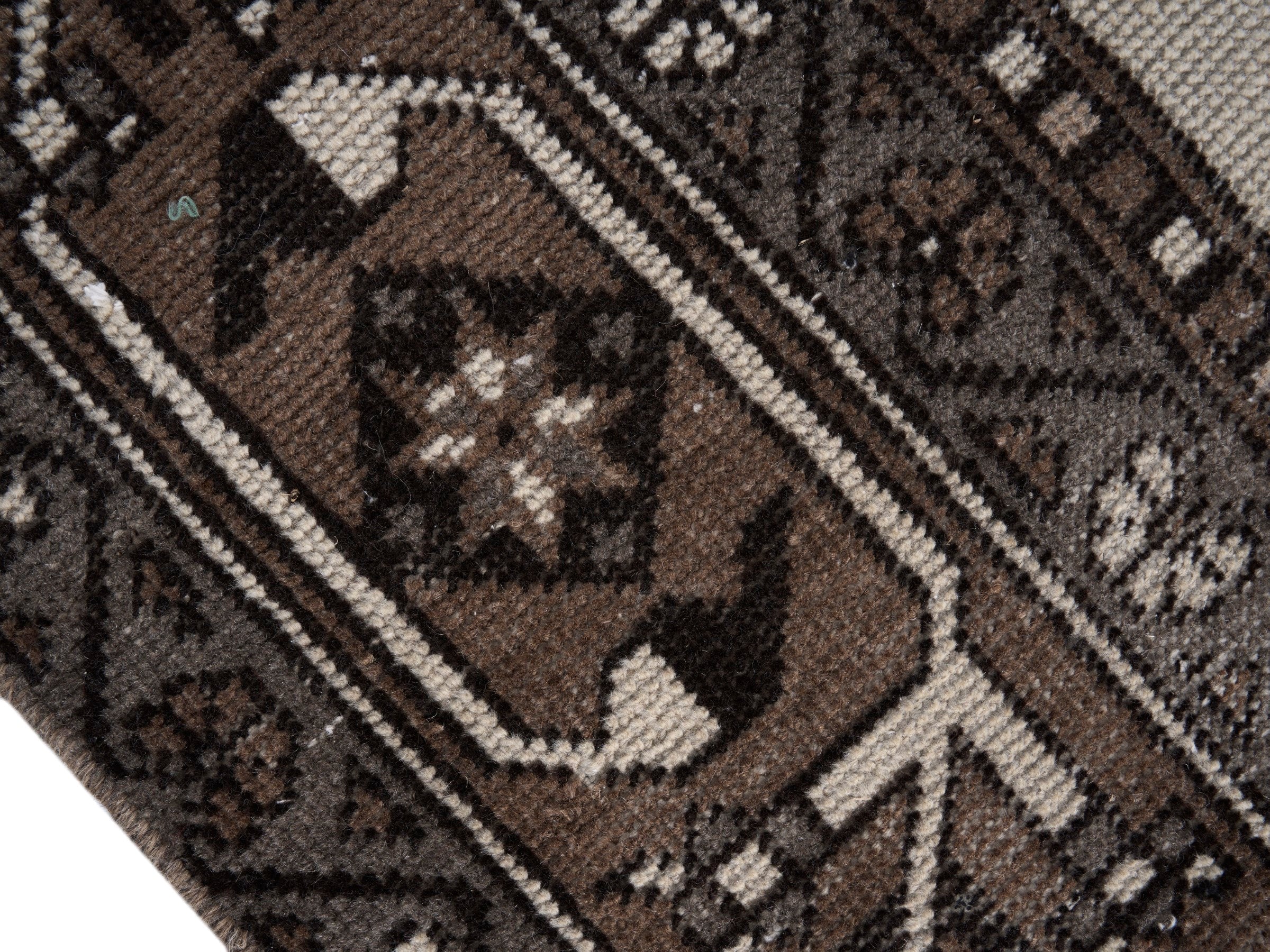 Persian Ferdos oversized rug in cream and brown, view 6 of 15