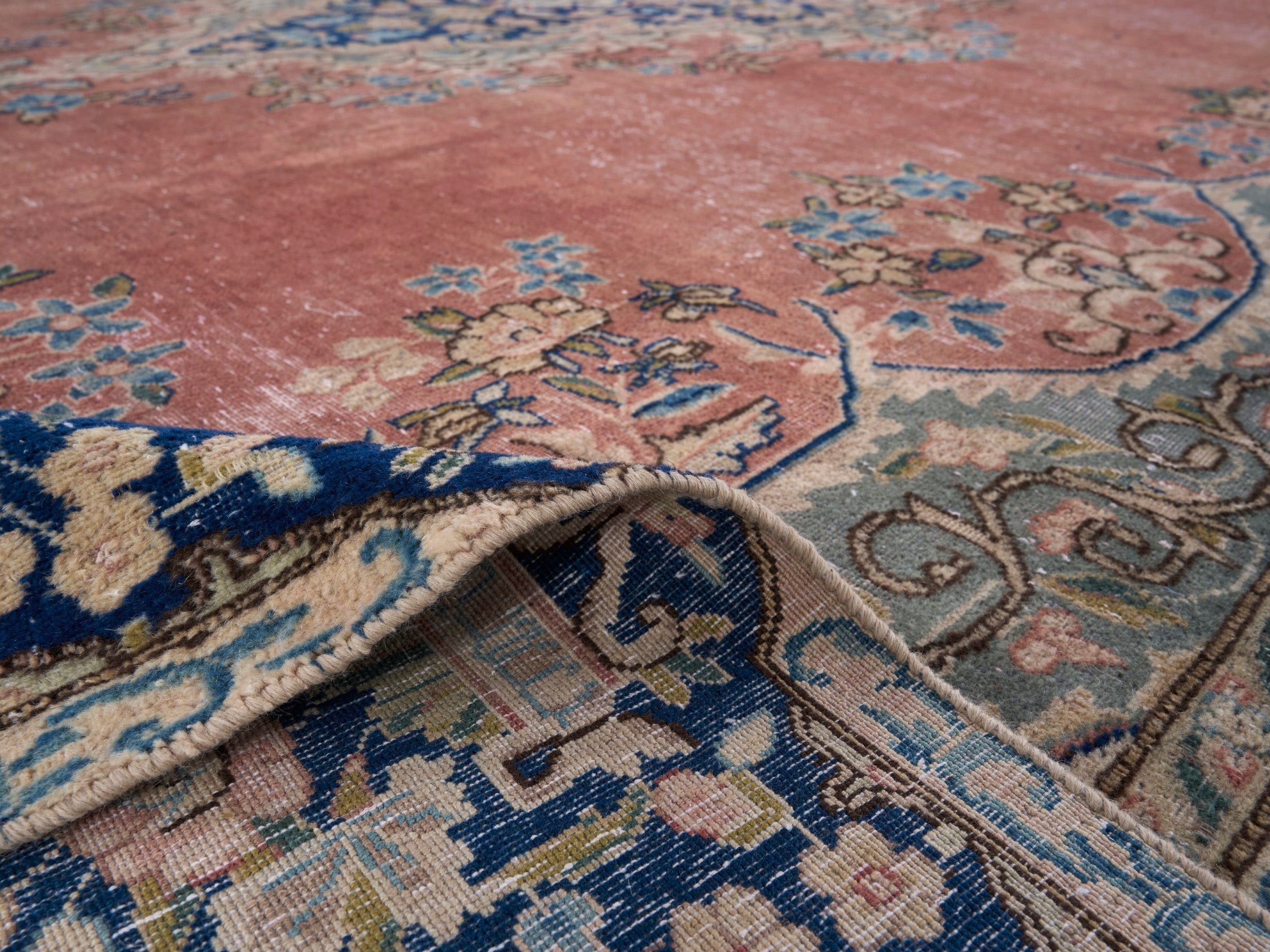 Persian Kerman oversized rug in rose and navy, view 14 of 15