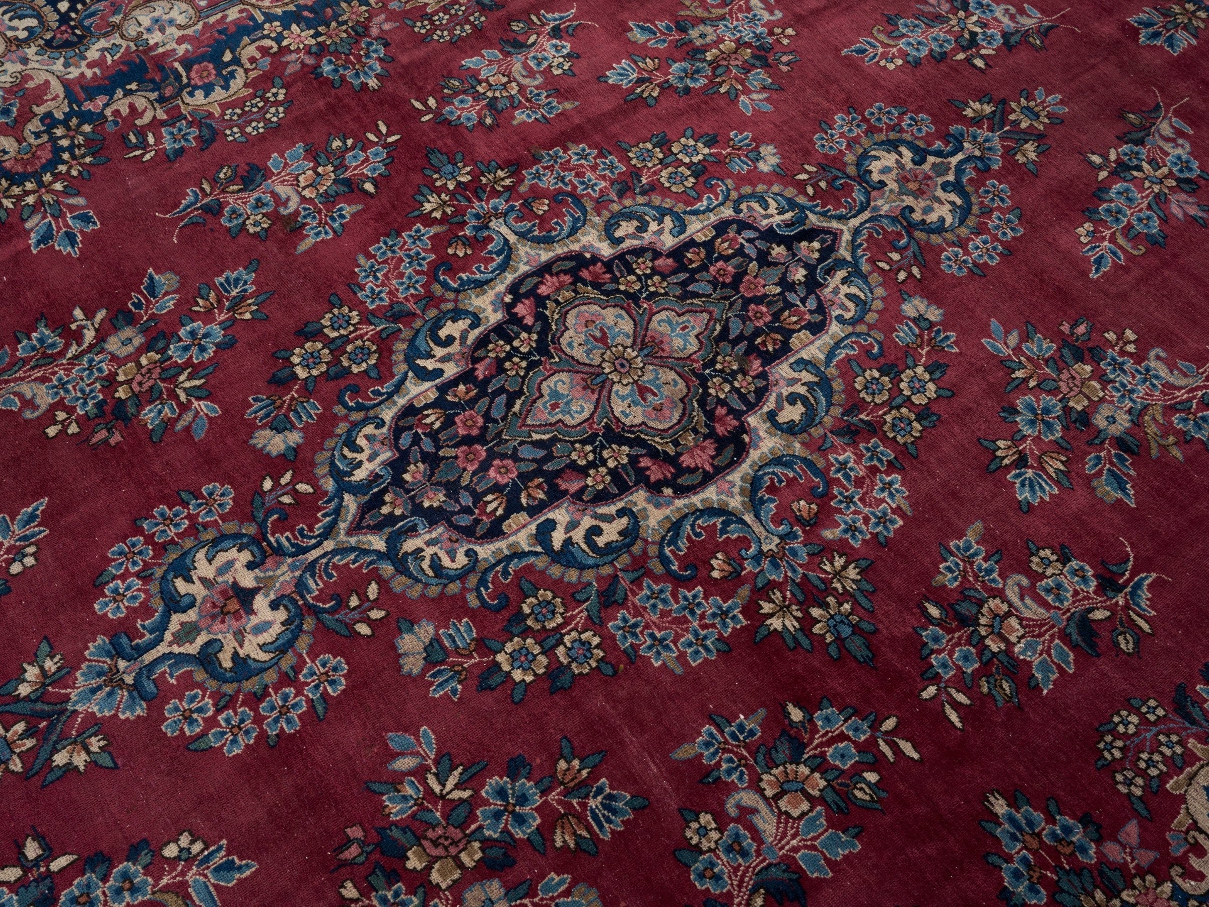 Persian Kerman oversized rug in deep red and navy, view 12 of 15
