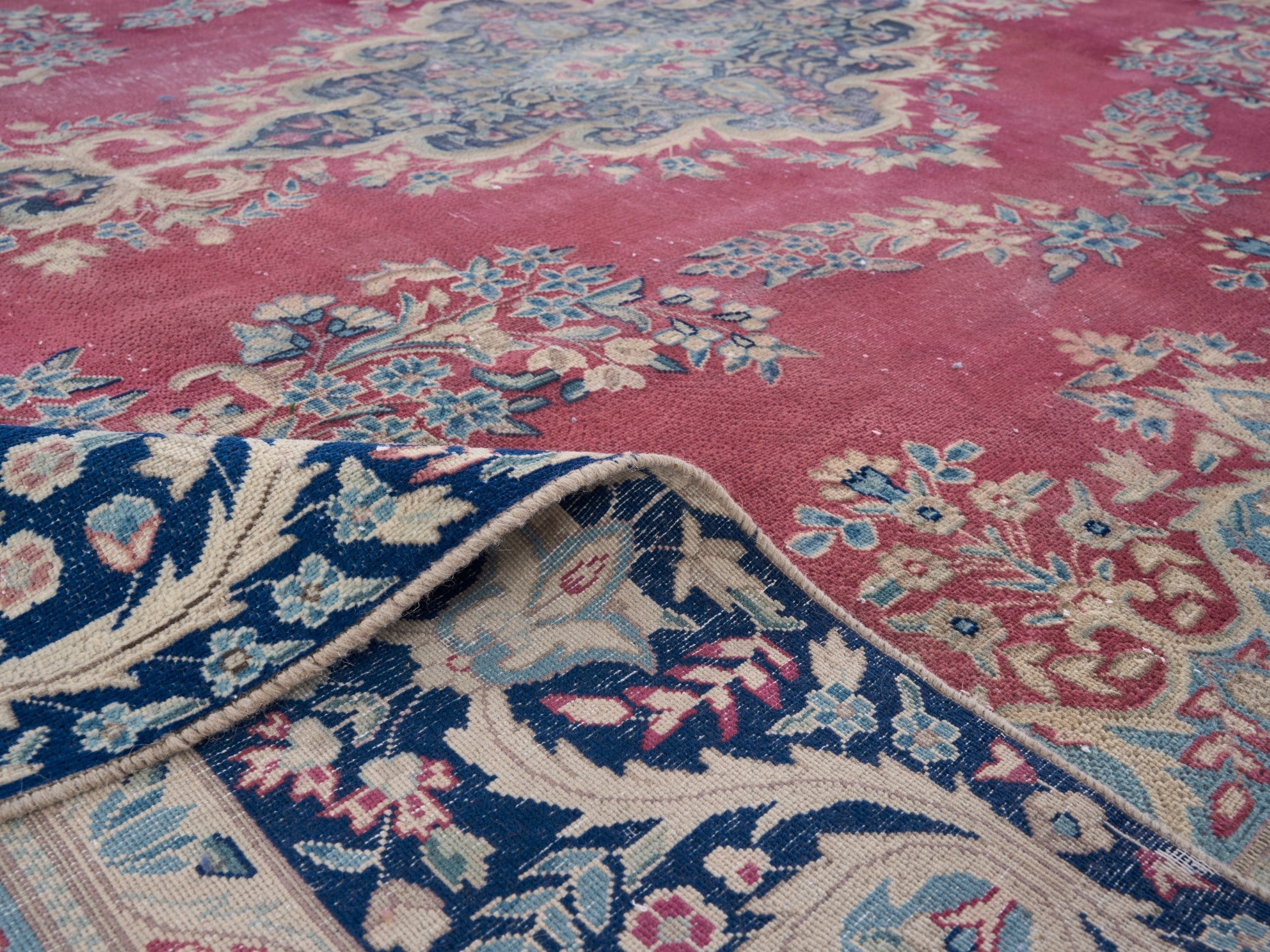Persian Kerman oversized rug in rose and navy, view 14 of 15