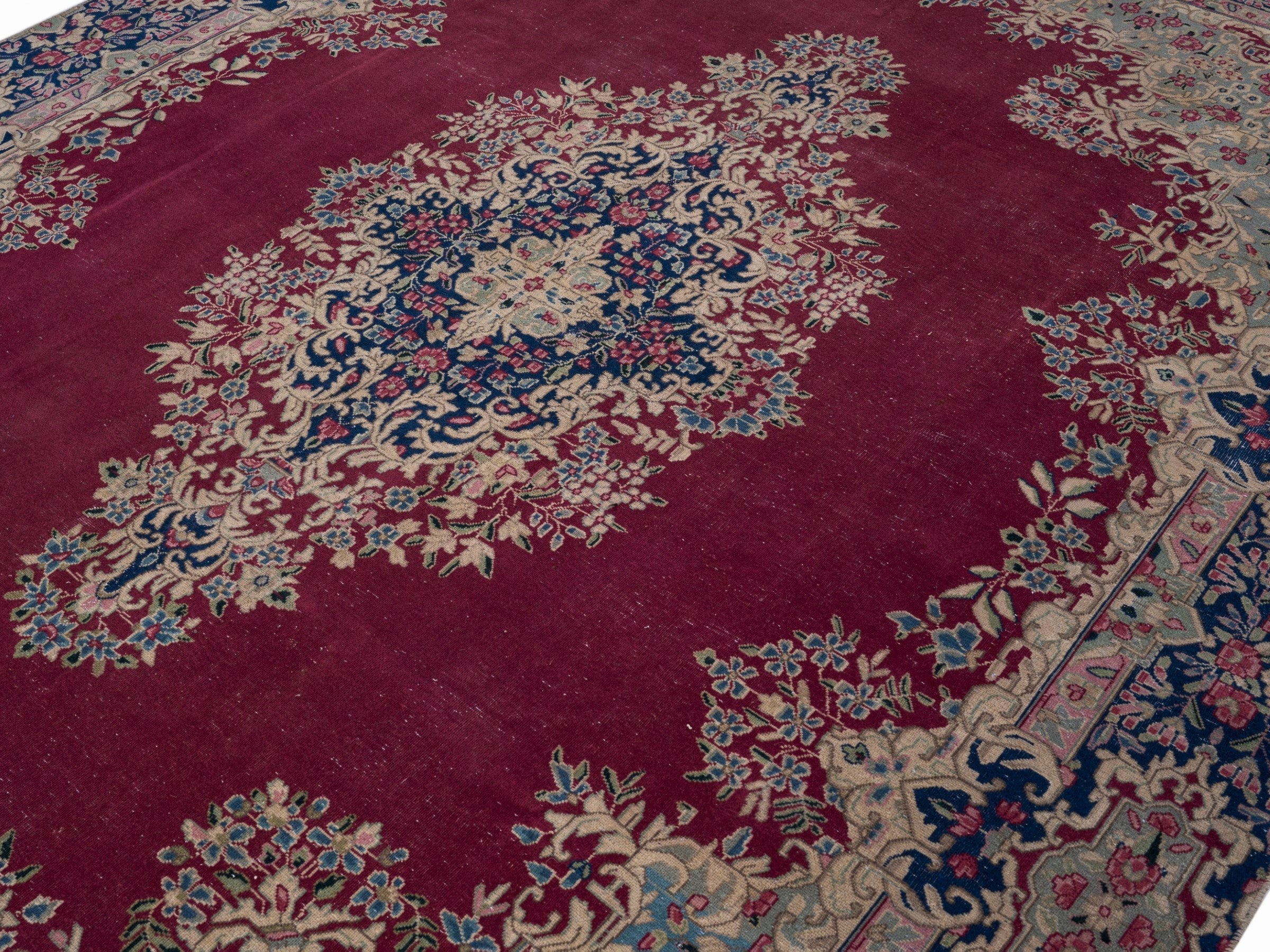 Persian Kerman oversized rug in deep red and navy, view 5 of 15