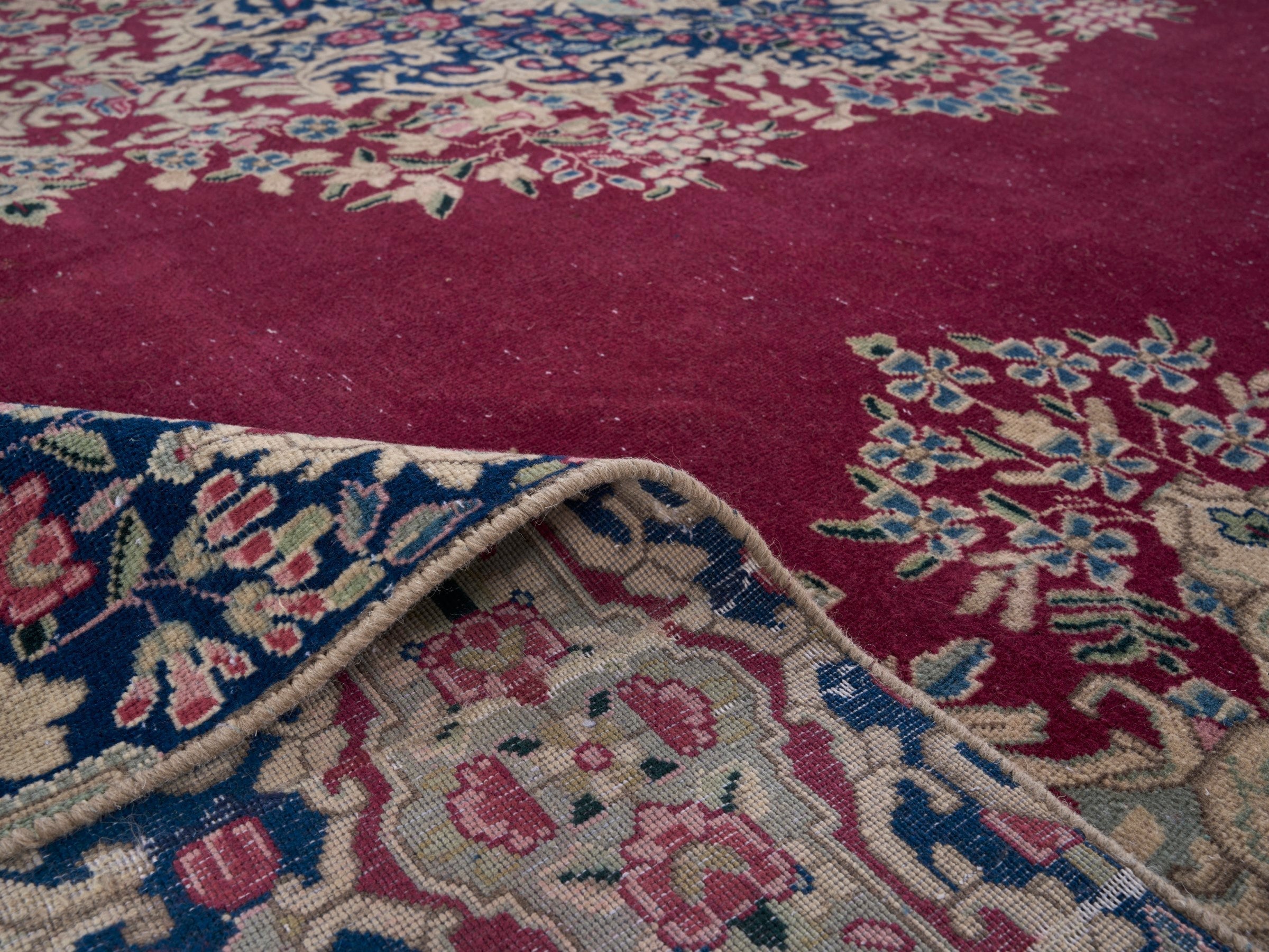 Persian Kerman oversized rug in deep red and navy, view 14 of 15