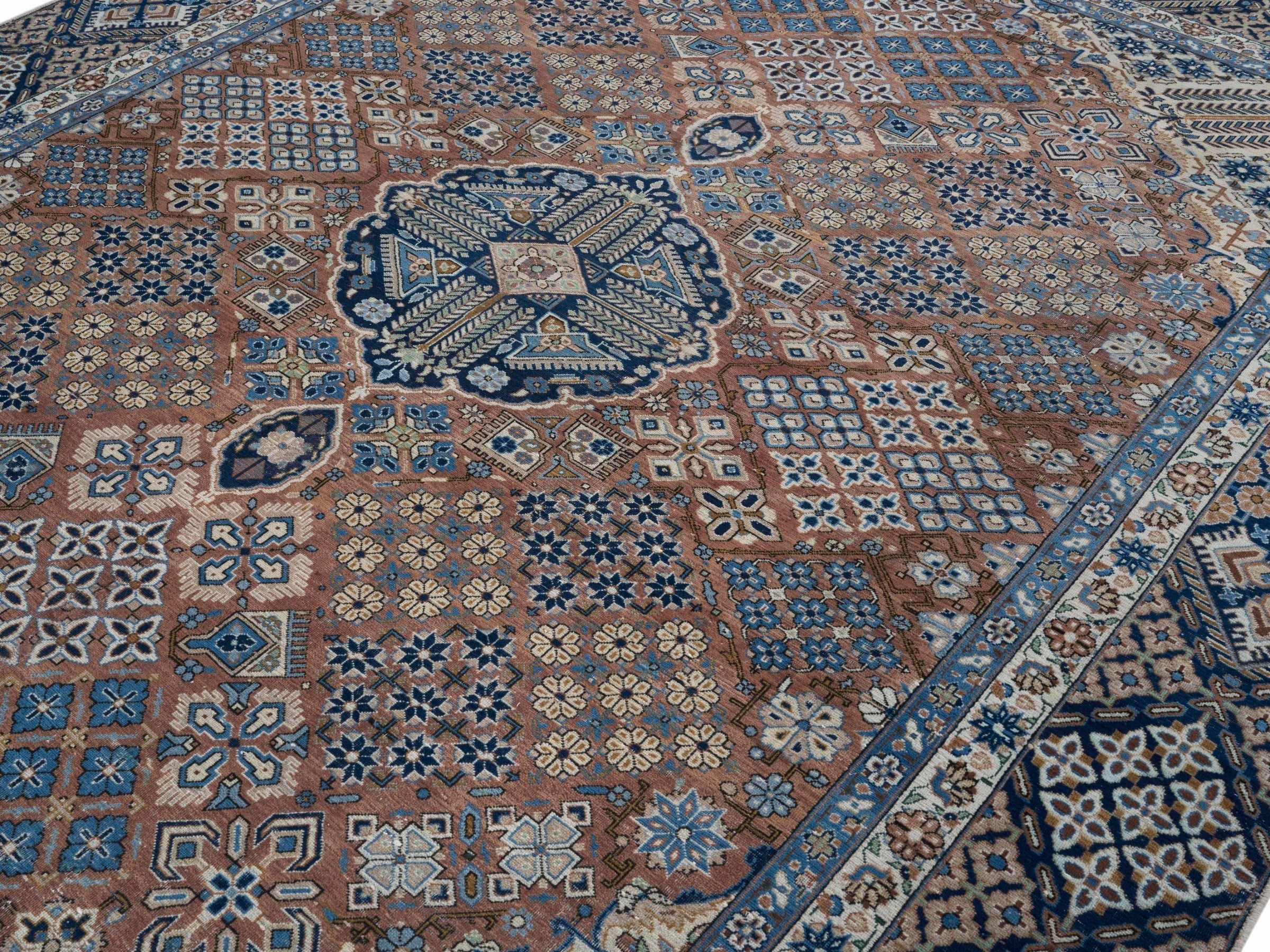 Persian Kashan oversized rug in rust and navy, view 5 of 15