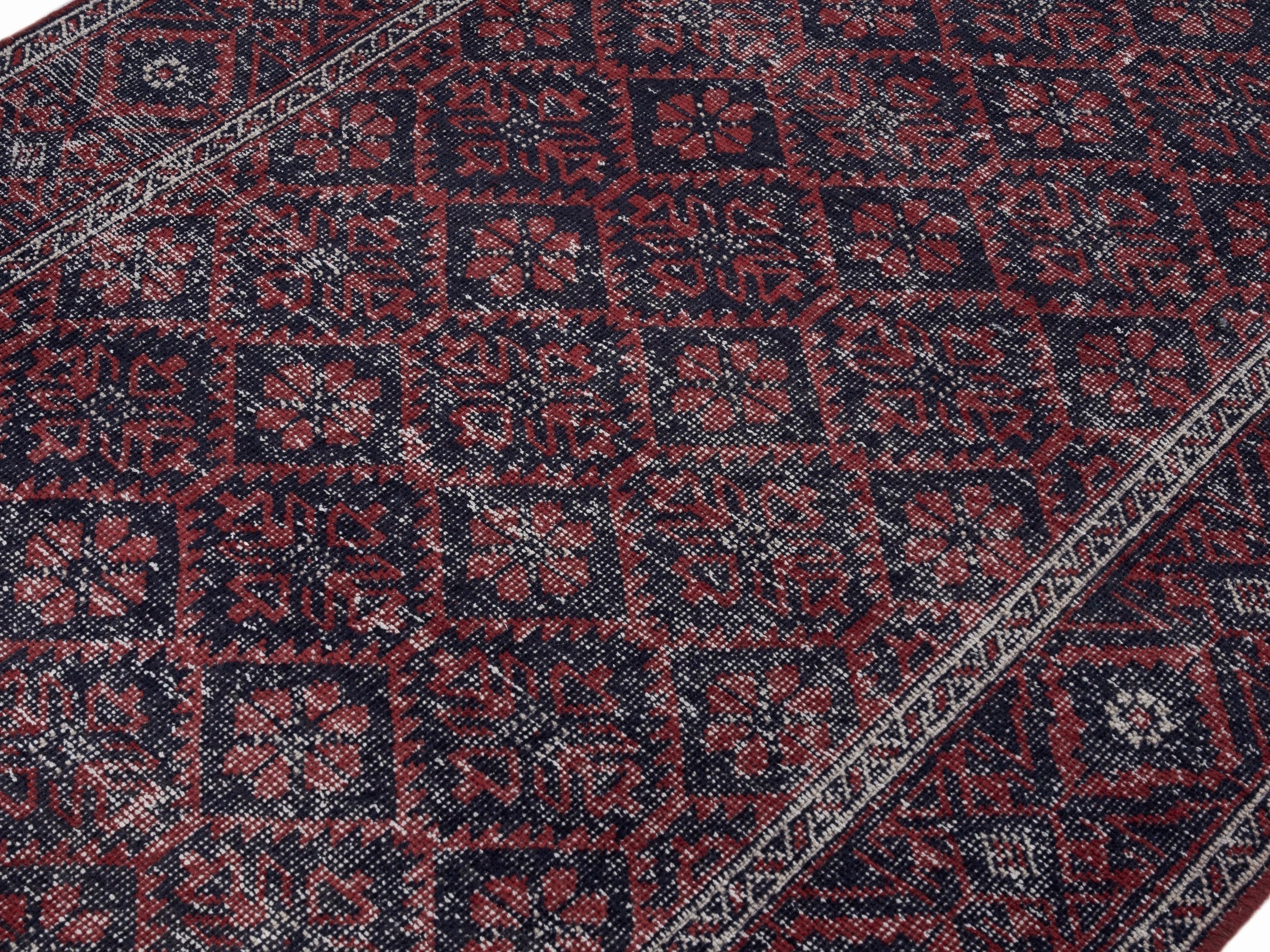 Persian Baluch area rug in burgundy and faded red, view 5 of 10
