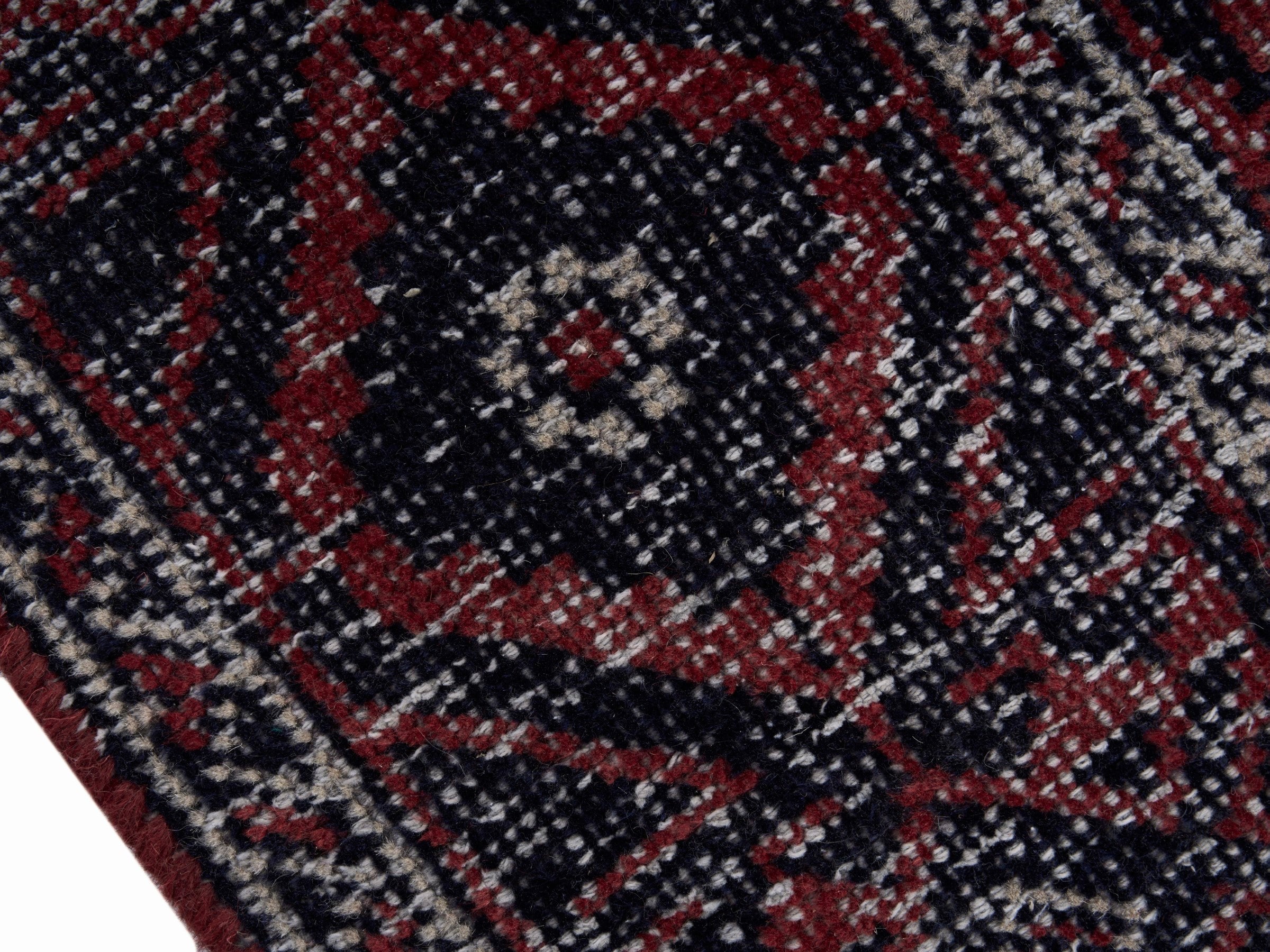 Persian Baluch area rug in burgundy and faded red, view 6 of 10