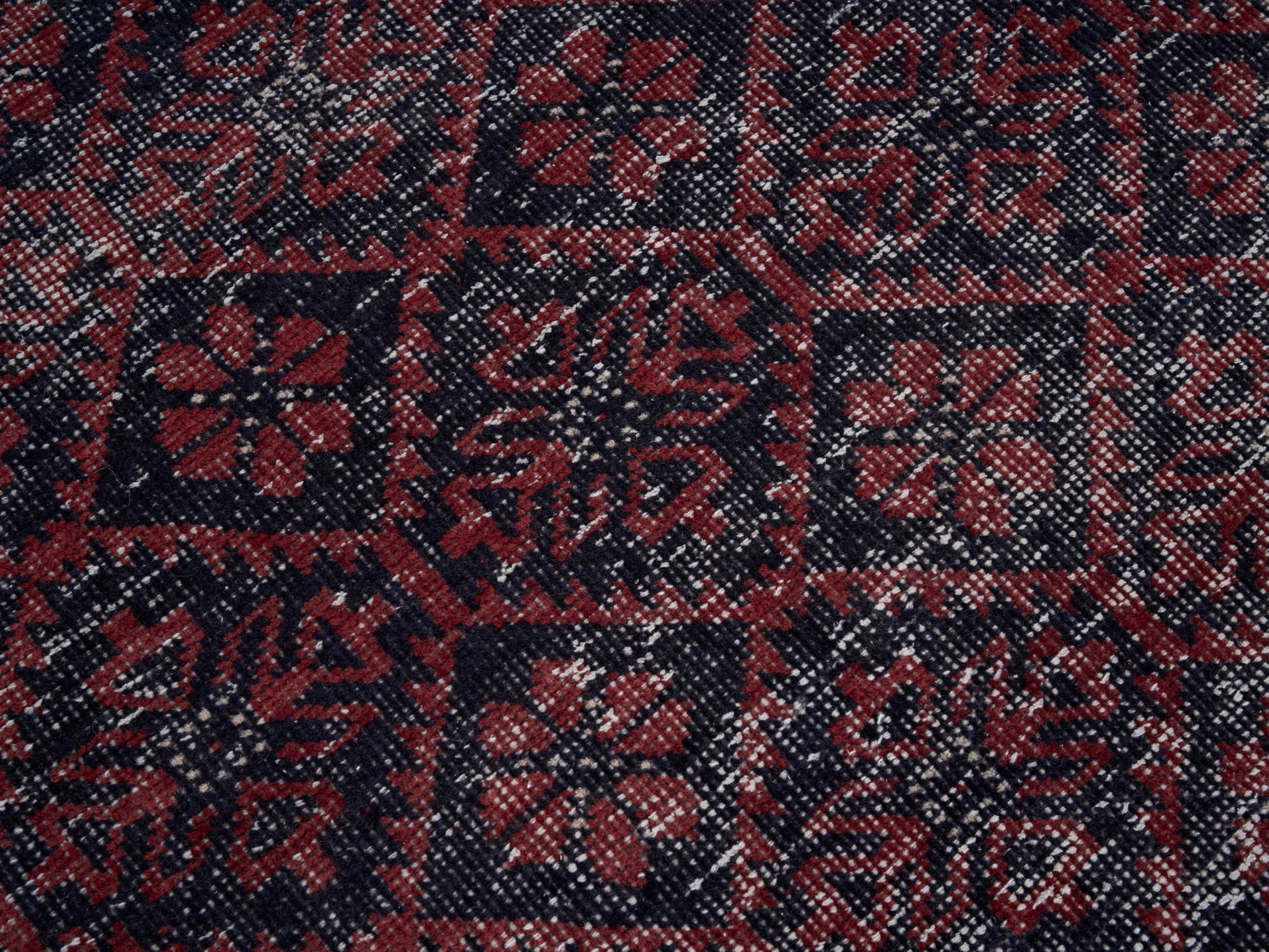 Persian Baluch area rug in burgundy and faded red, view 7 of 10