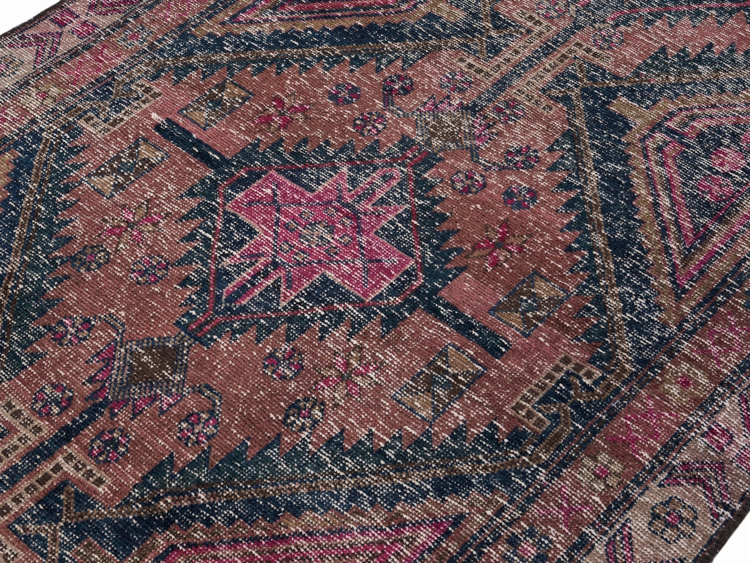 Persian Lori area rug in dusty rose and deep indigo, view 5 of 10