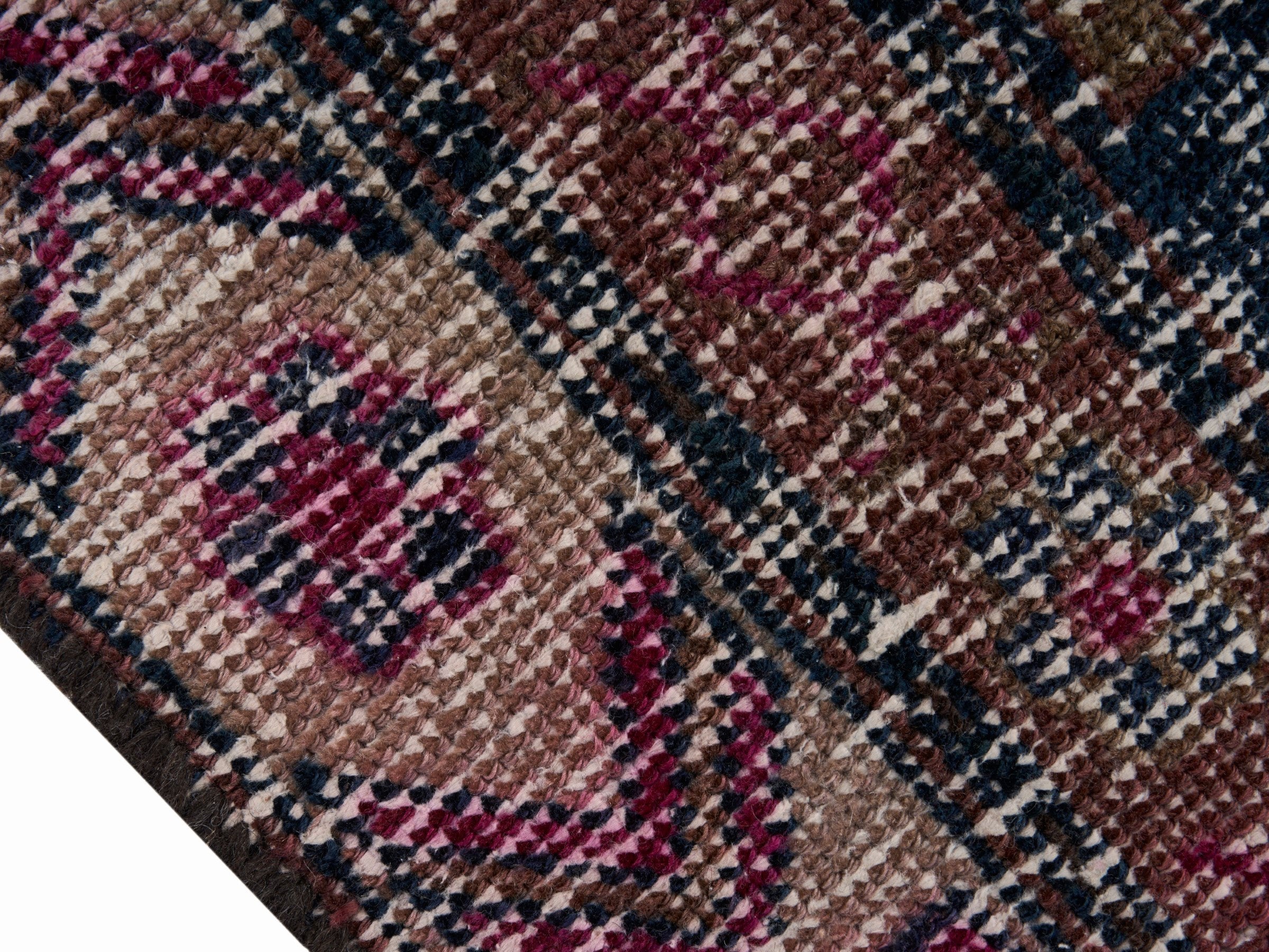 Persian Lori area rug in dusty rose and deep indigo, view 6 of 10