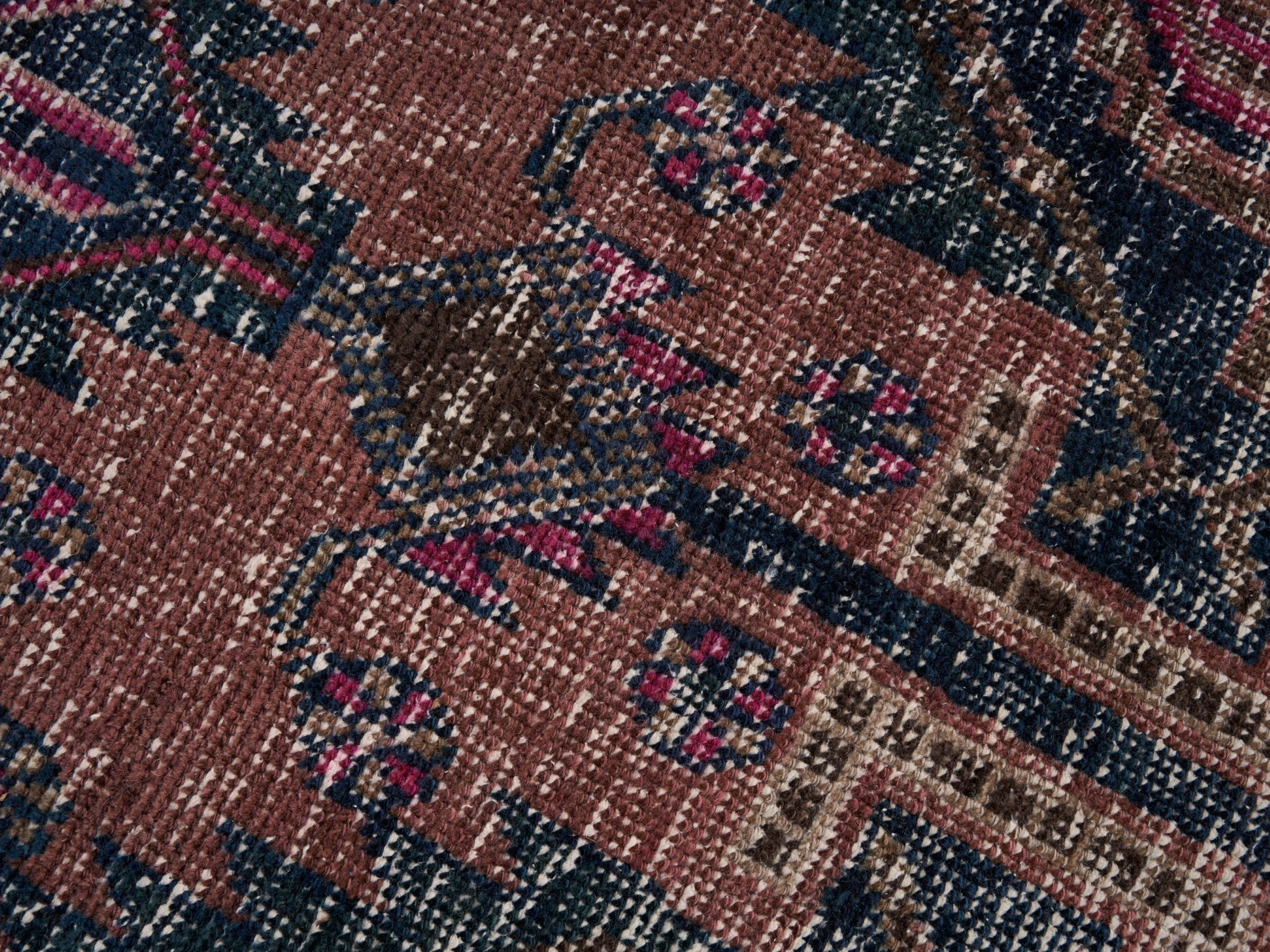 Persian Lori area rug in dusty rose and deep indigo, view 7 of 10