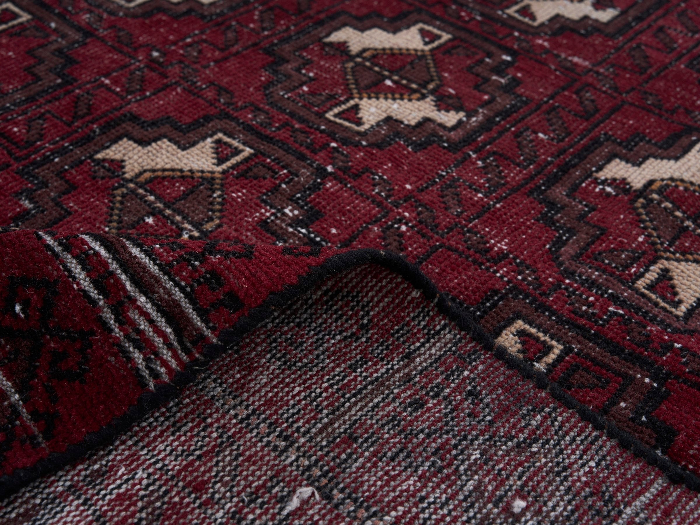 Persian Baluch area rug in burgundy and cream, view 9 of 10
