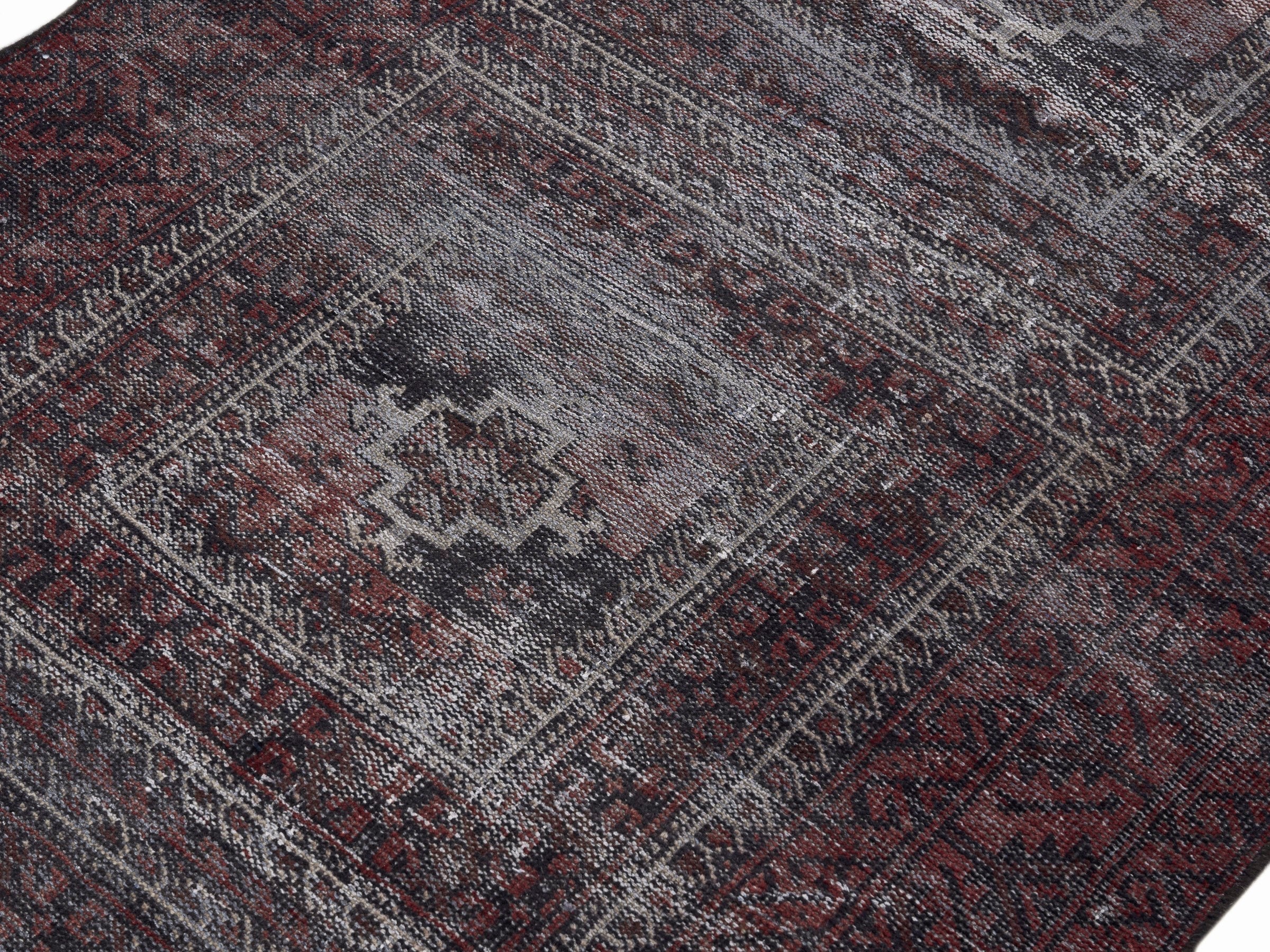Persian Baluch area rug in burgundy and sage, view 5 of 10