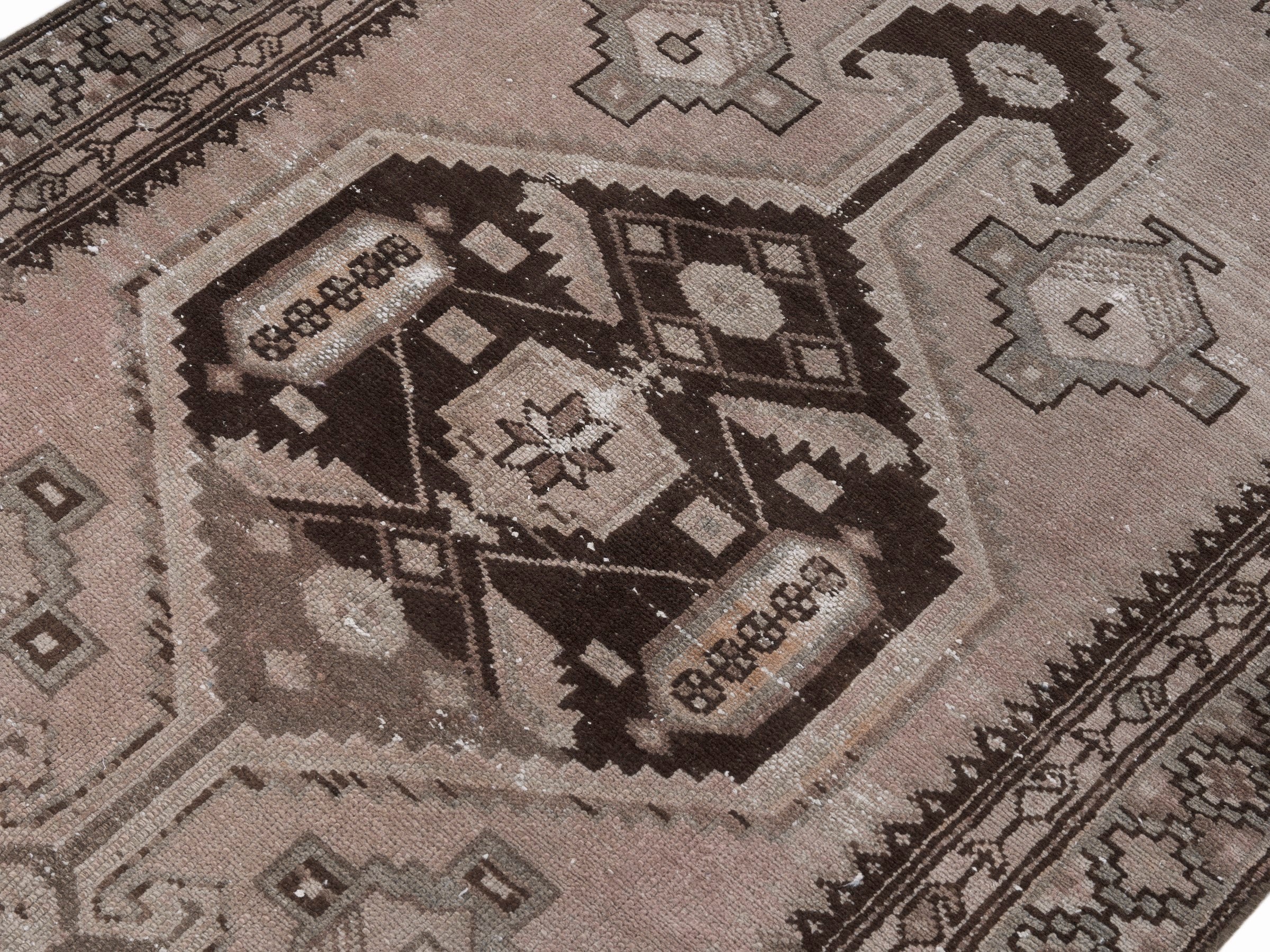 Persian Zanjan accent rug in muted pink and dark brown, view 5 of 10