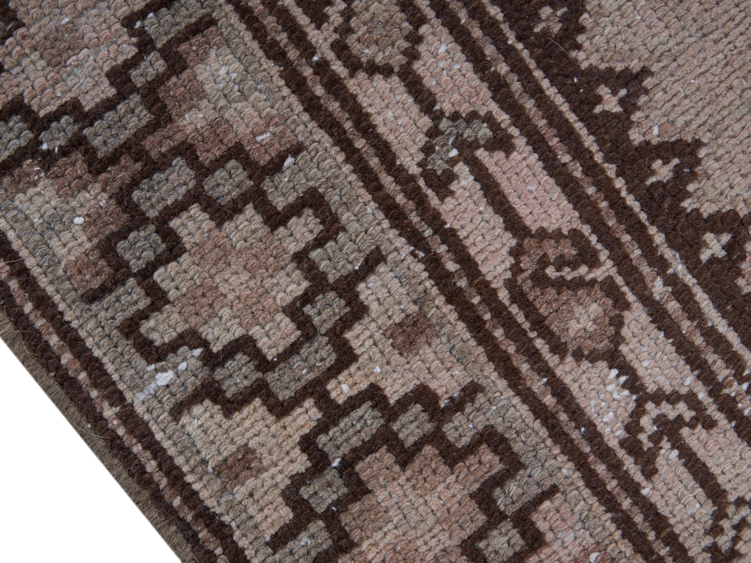 Persian Zanjan accent rug in muted pink and dark brown, view 6 of 10