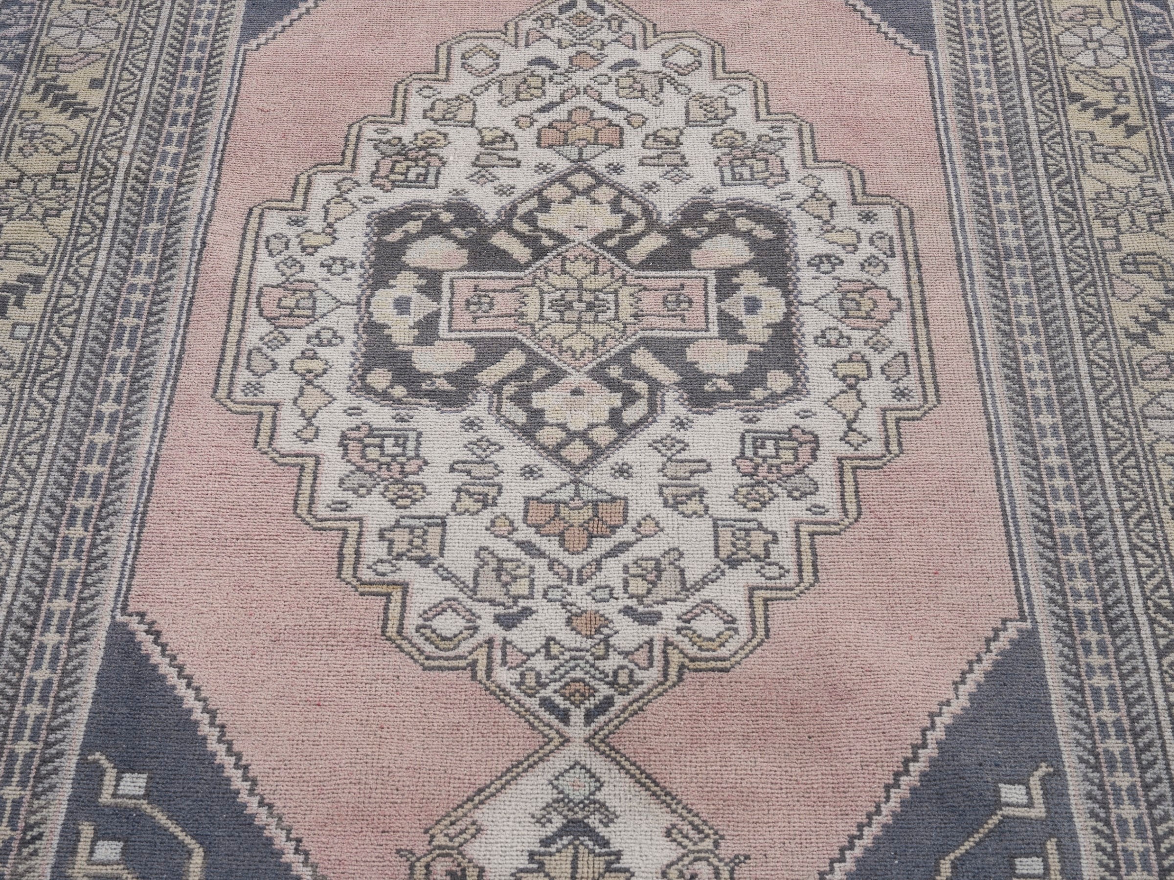 Turkish Anatolian area rug in navy and muted pink, view 4 of 10