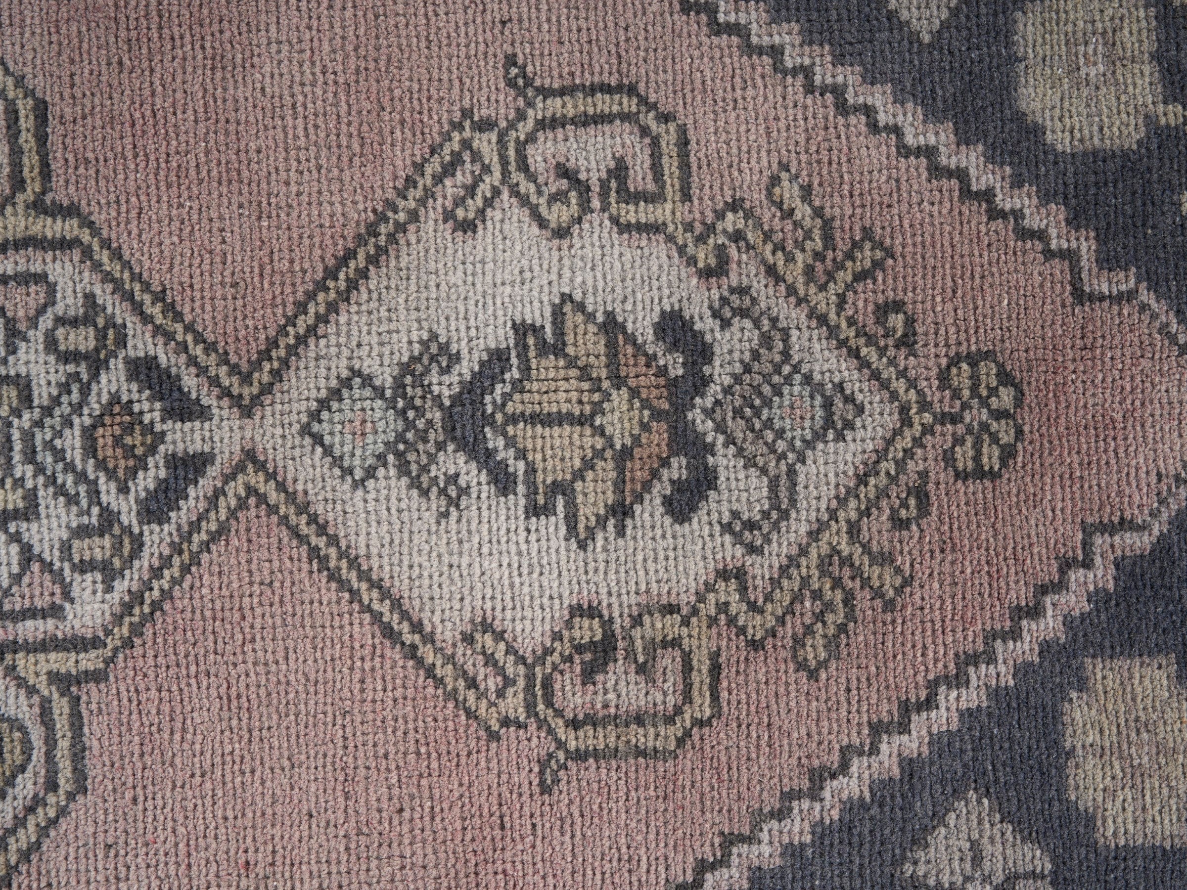 Turkish Anatolian area rug in navy and muted pink, view 7 of 10