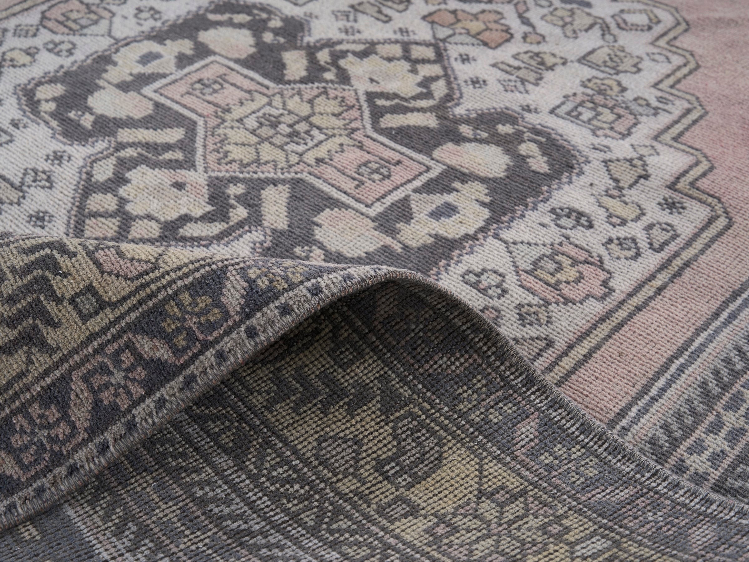 Turkish Anatolian area rug in navy and muted pink, view 9 of 10