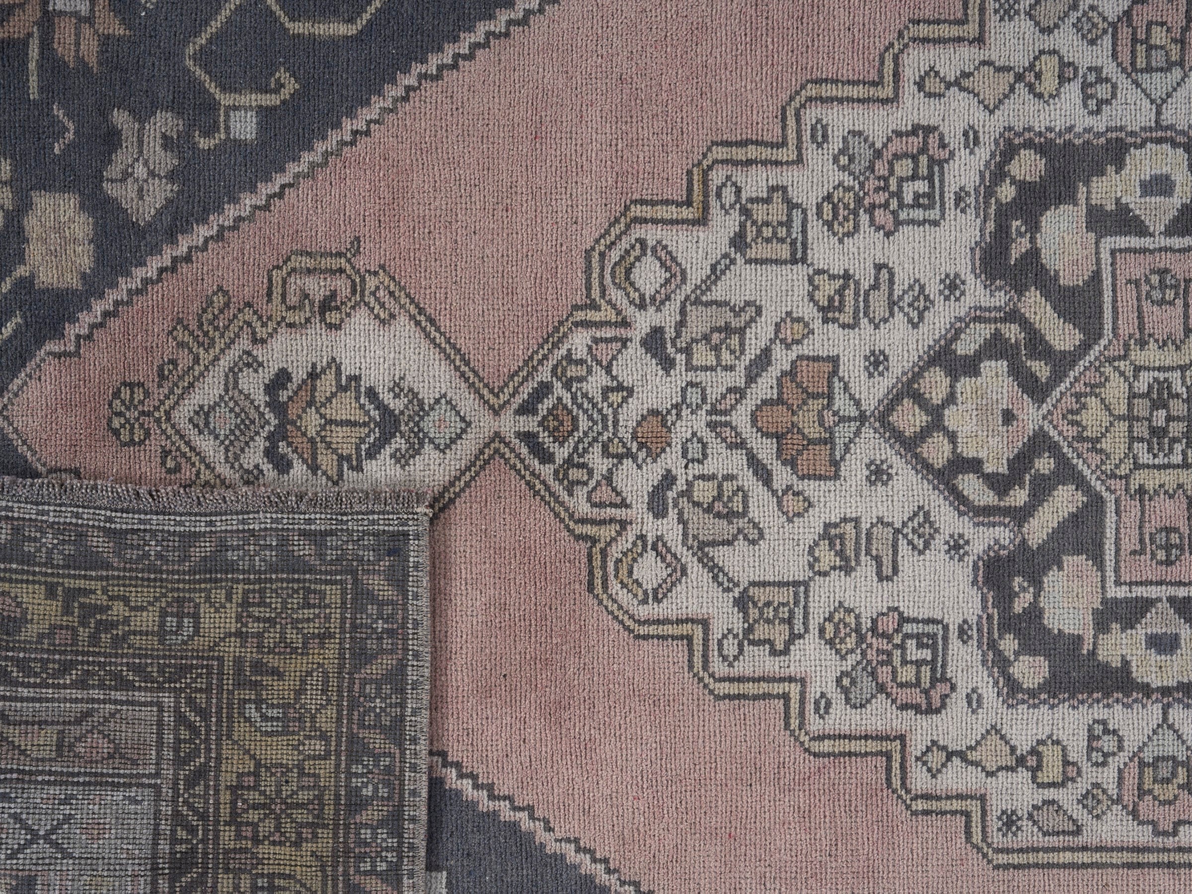 Turkish Anatolian area rug in navy and muted pink, view 10 of 10