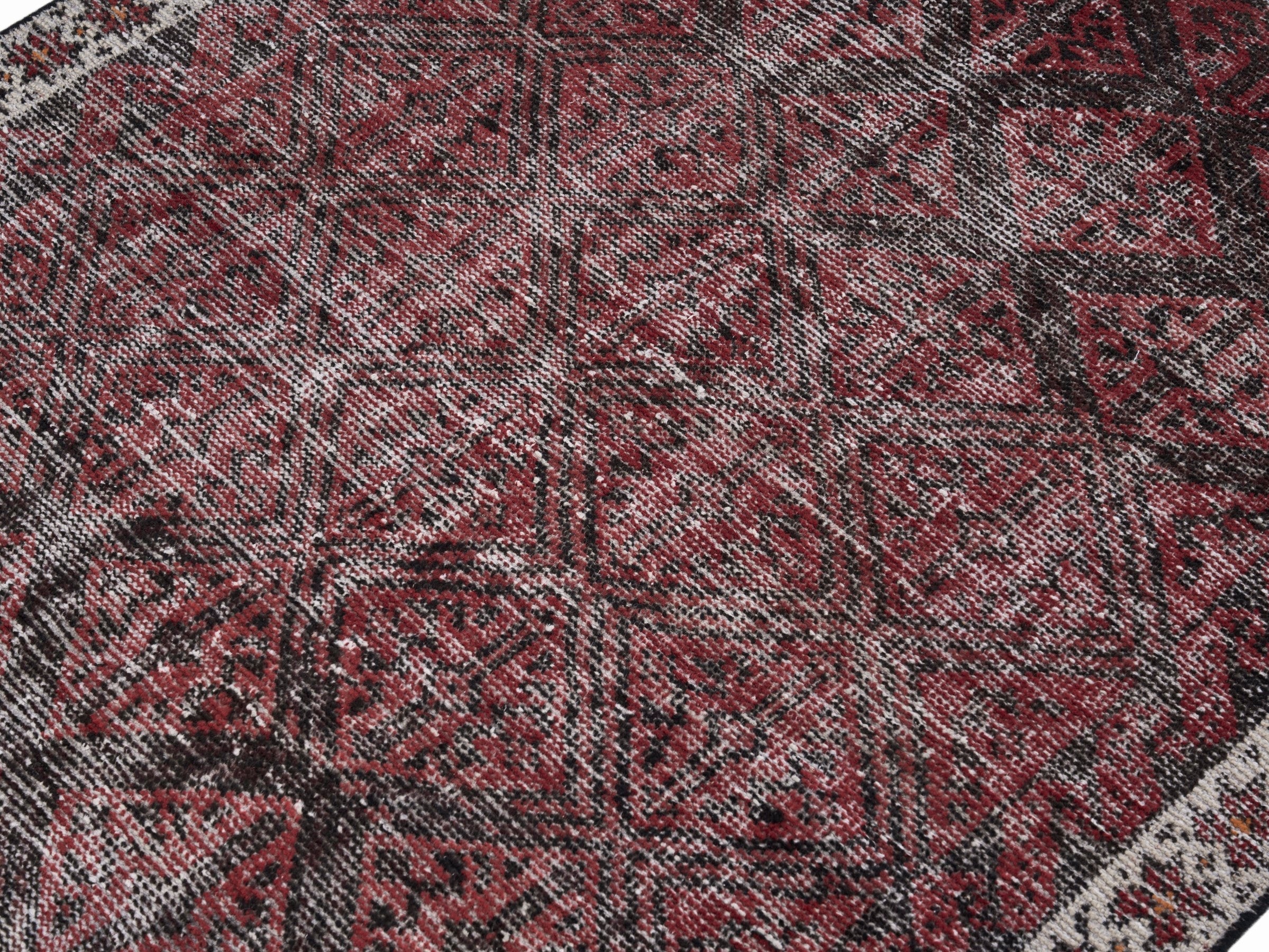Persian Baluch accent rug in burgundy and faded red, view 5 of 10