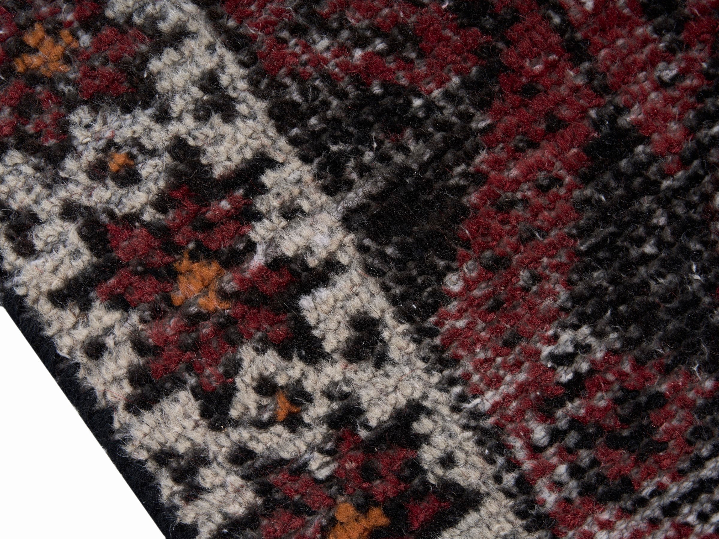 Persian Baluch accent rug in burgundy and faded red, view 6 of 10